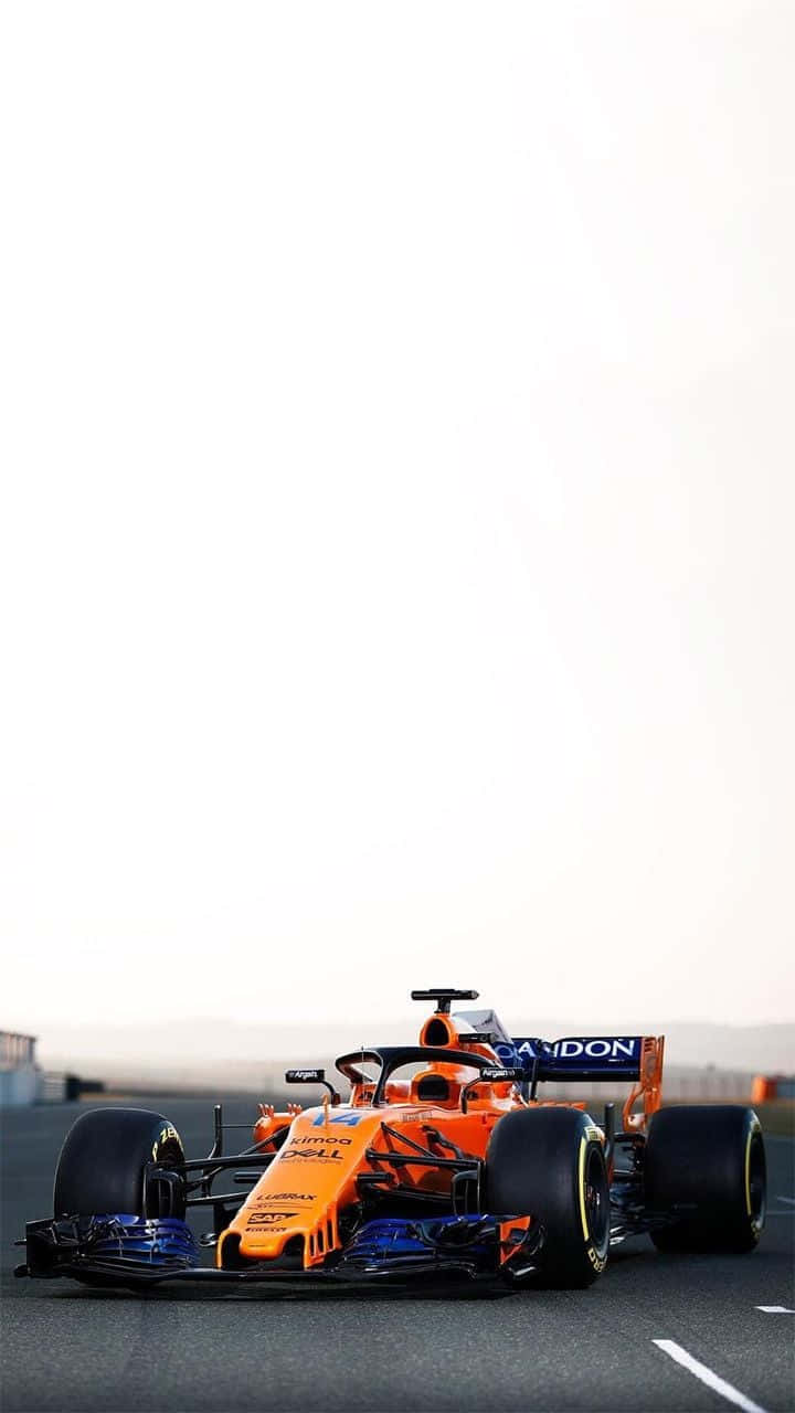 "The iconic fiery orange and sharp curves of a McLaren Formula 1 race car" Wallpaper