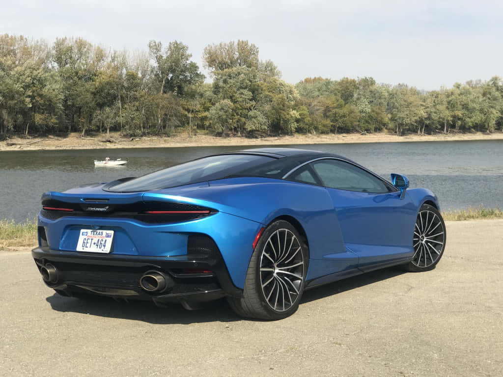 Luxurious McLaren GT on Open Road Wallpaper