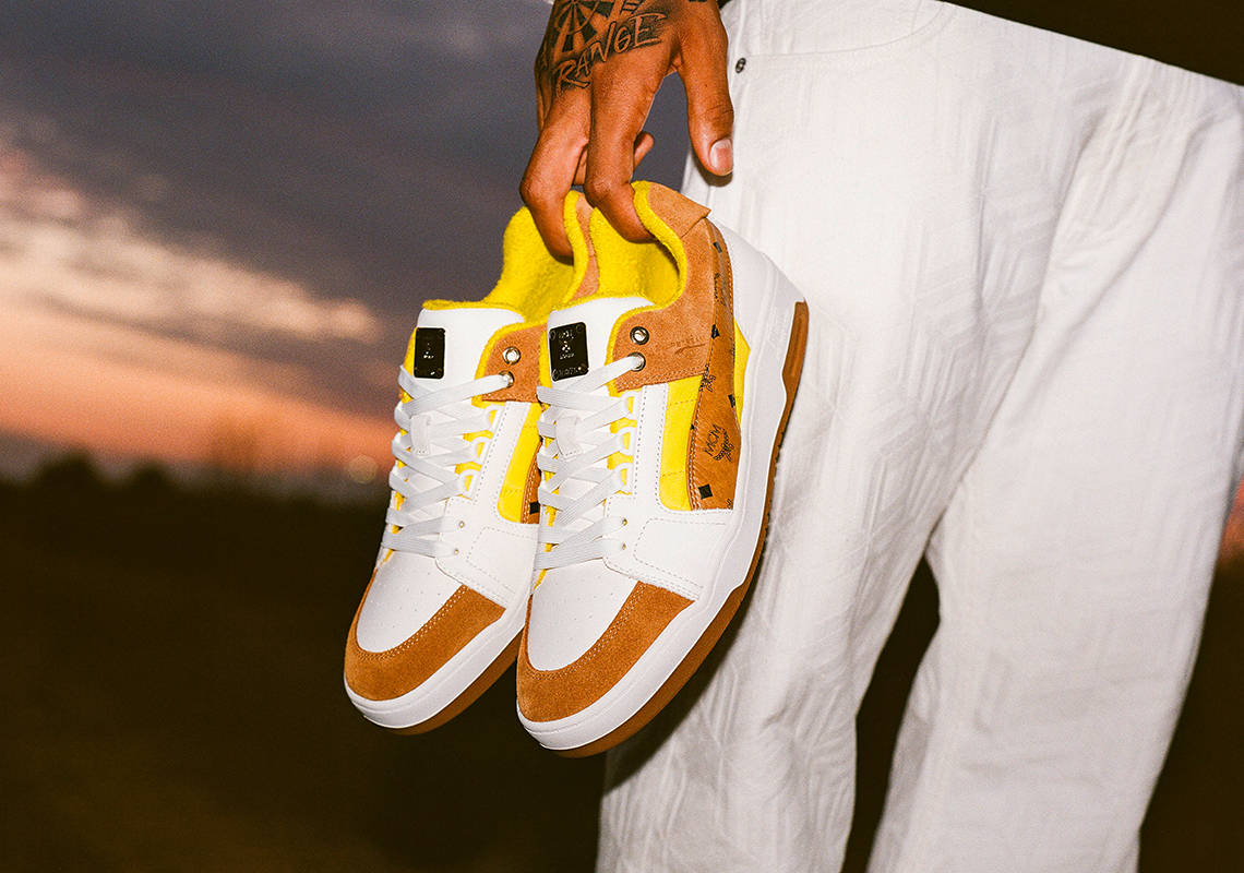Caption: Stylish MCM White and Brown Sneakers Wallpaper