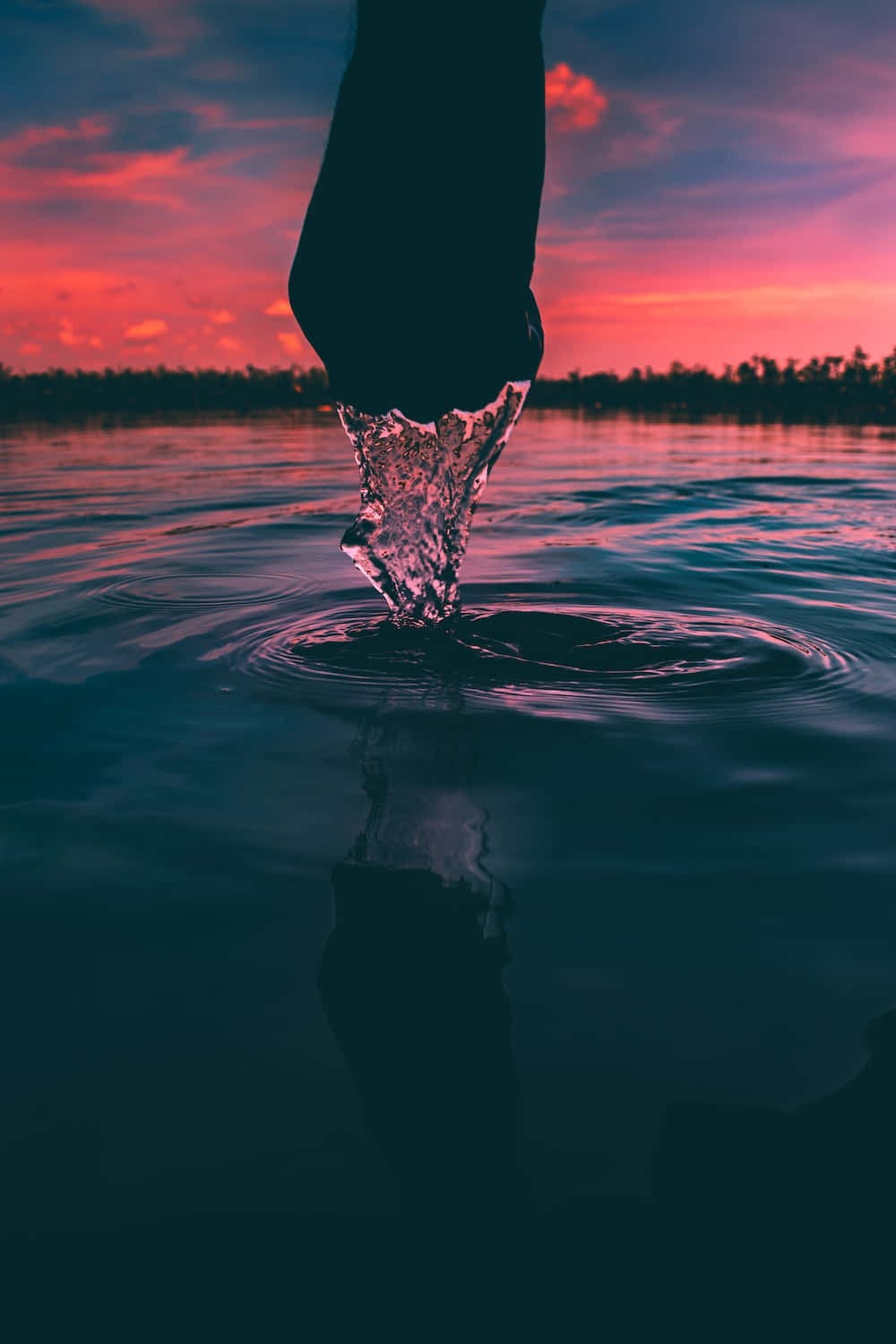 A Person Is Standing In The Water