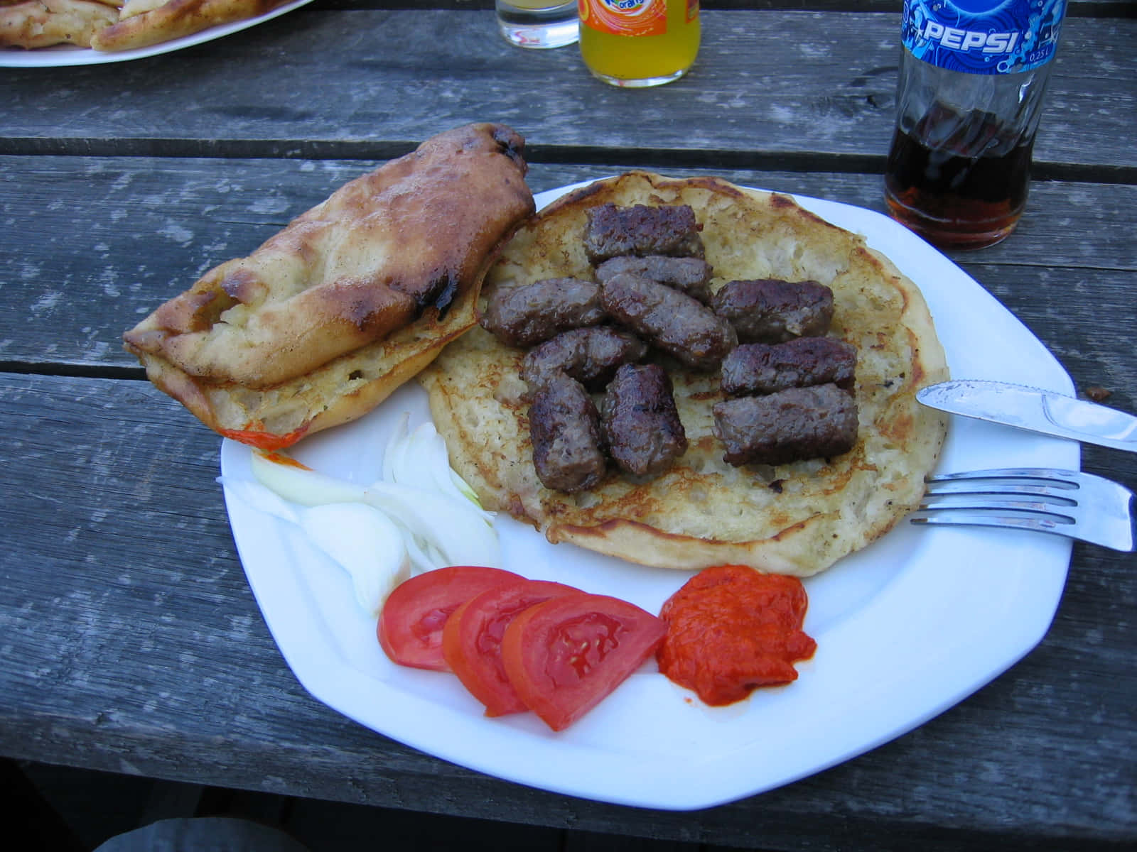 Meaty Ćevapi Sausages With Tomato Slices Wallpaper