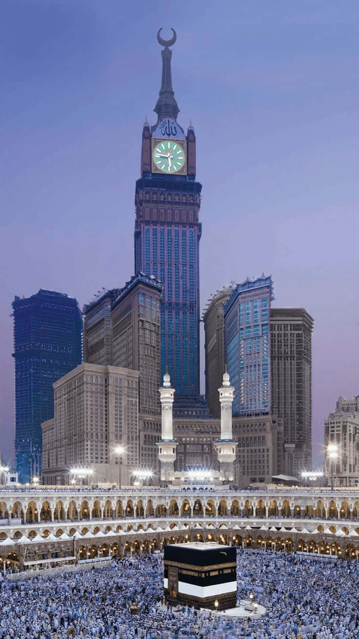 A Mosque With A Clock Tower In The Background