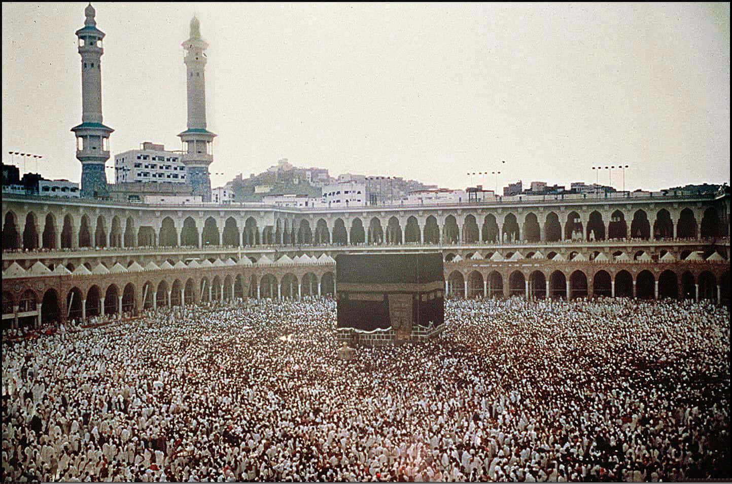A Large Crowd Of People Gathered Around The Kaaba