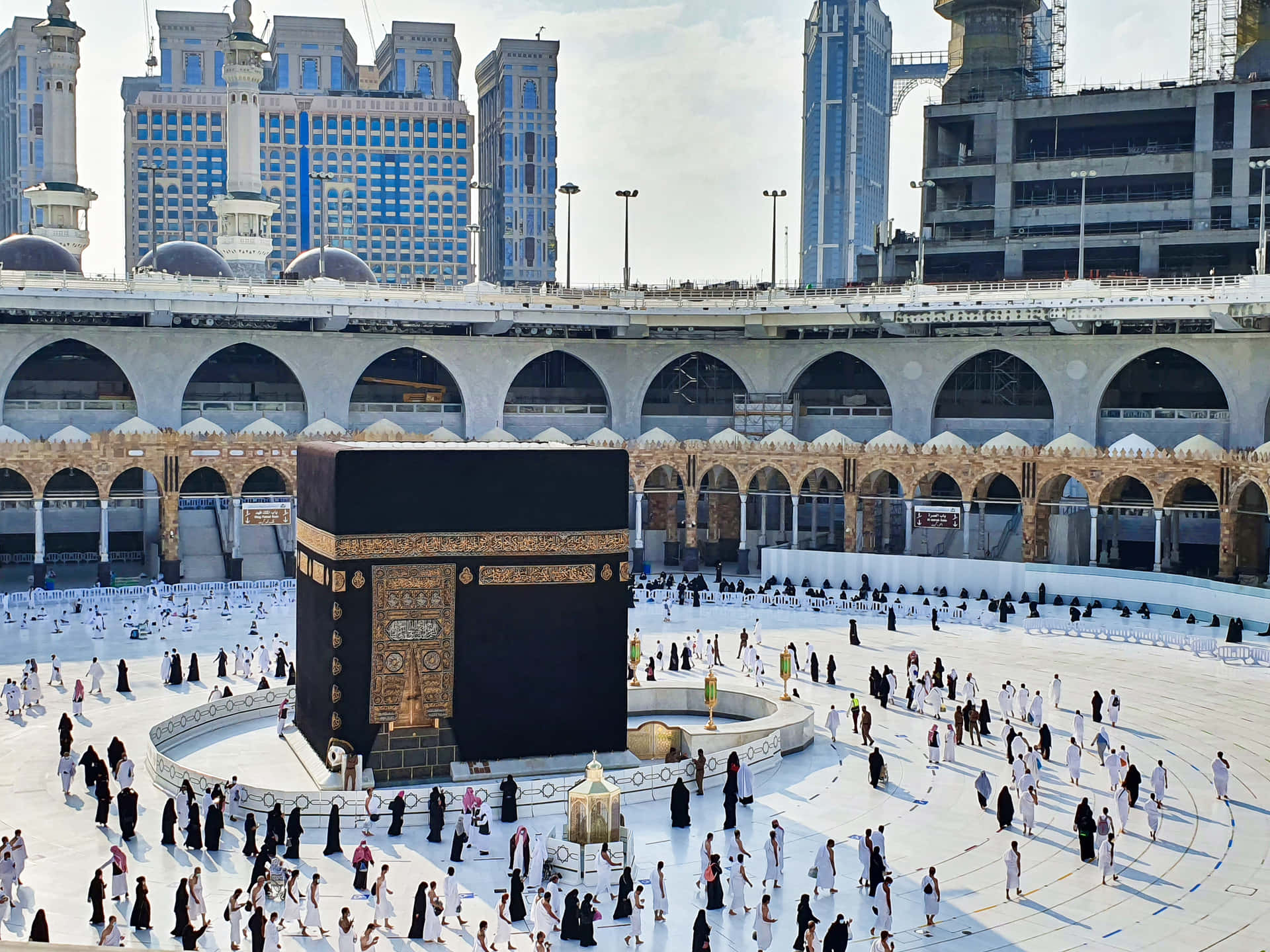 A Large Square With People Standing Around A Kaaba