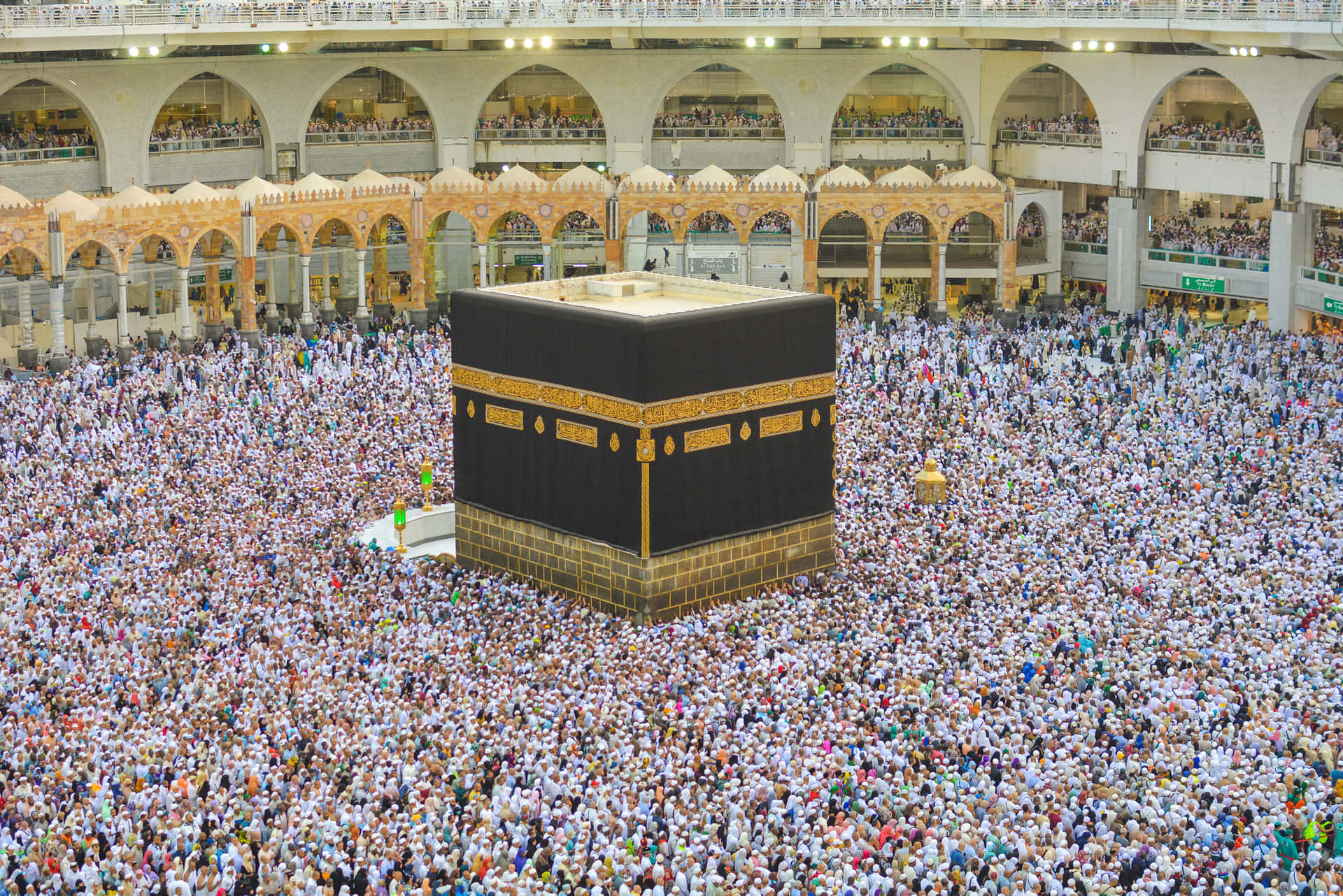 A Large Crowd Of People Gathered Around A Kaaba