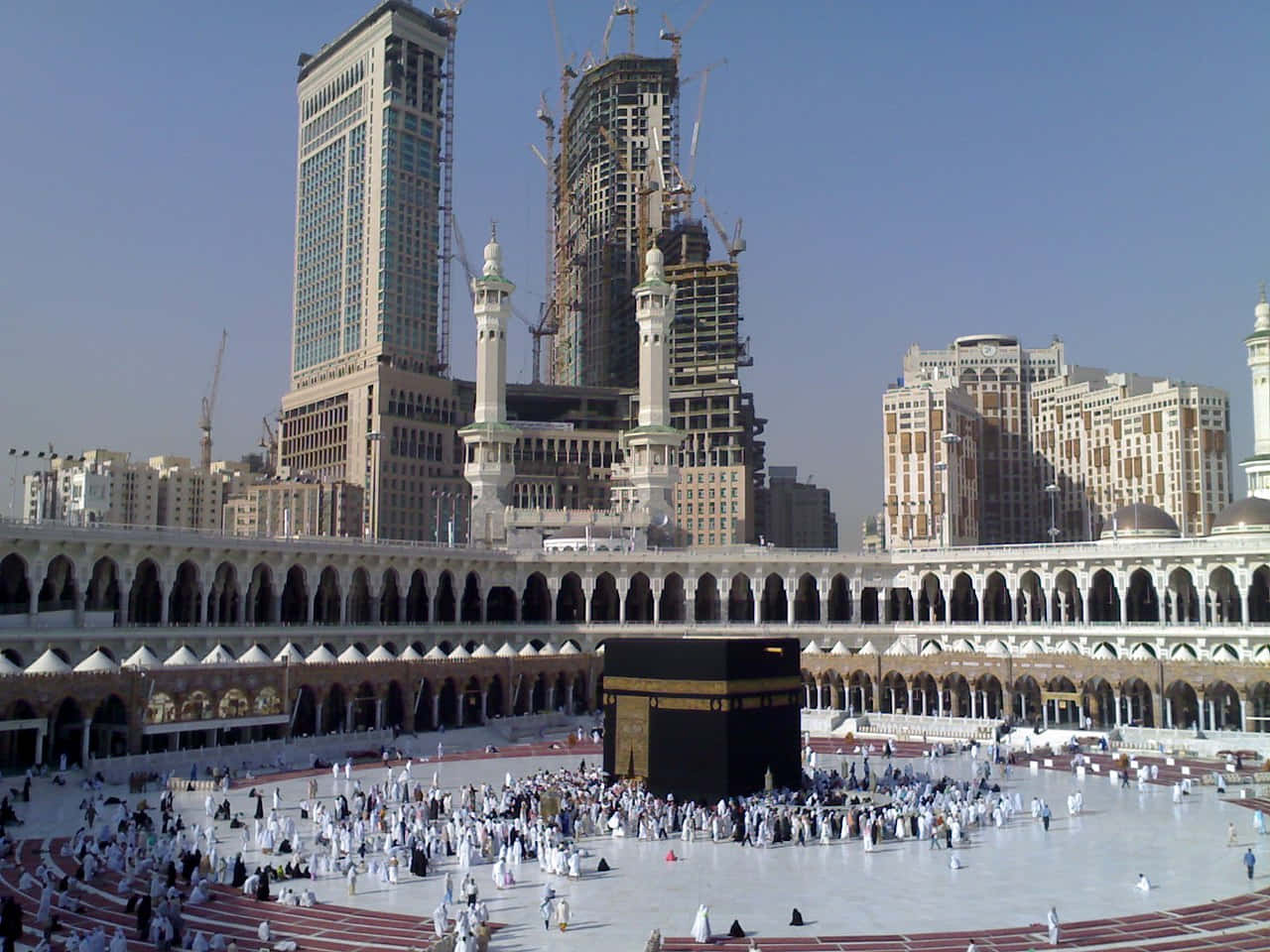 A Large Square With People Standing Around A Kaaba