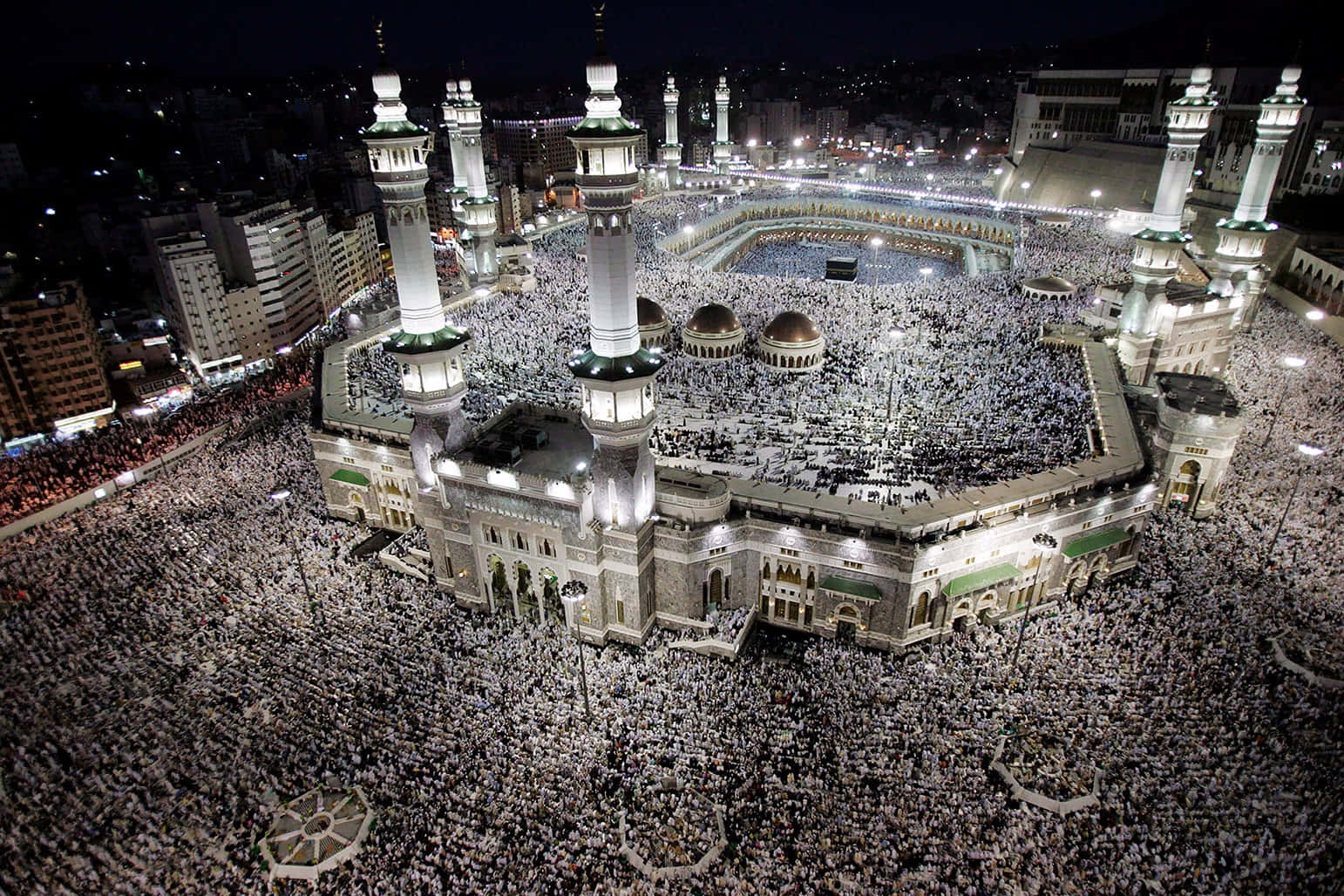 A Large Crowd Gathers Around The Kaaba