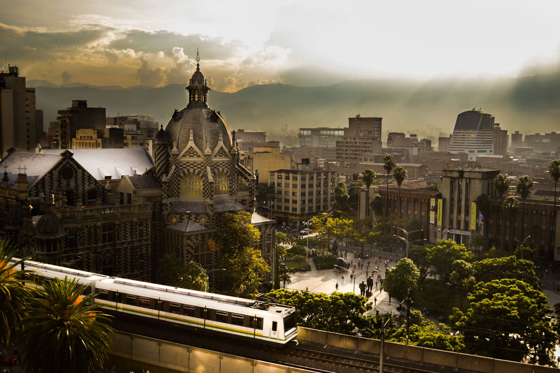 Vibrant Medellin Cityscape with Metro View Wallpaper
