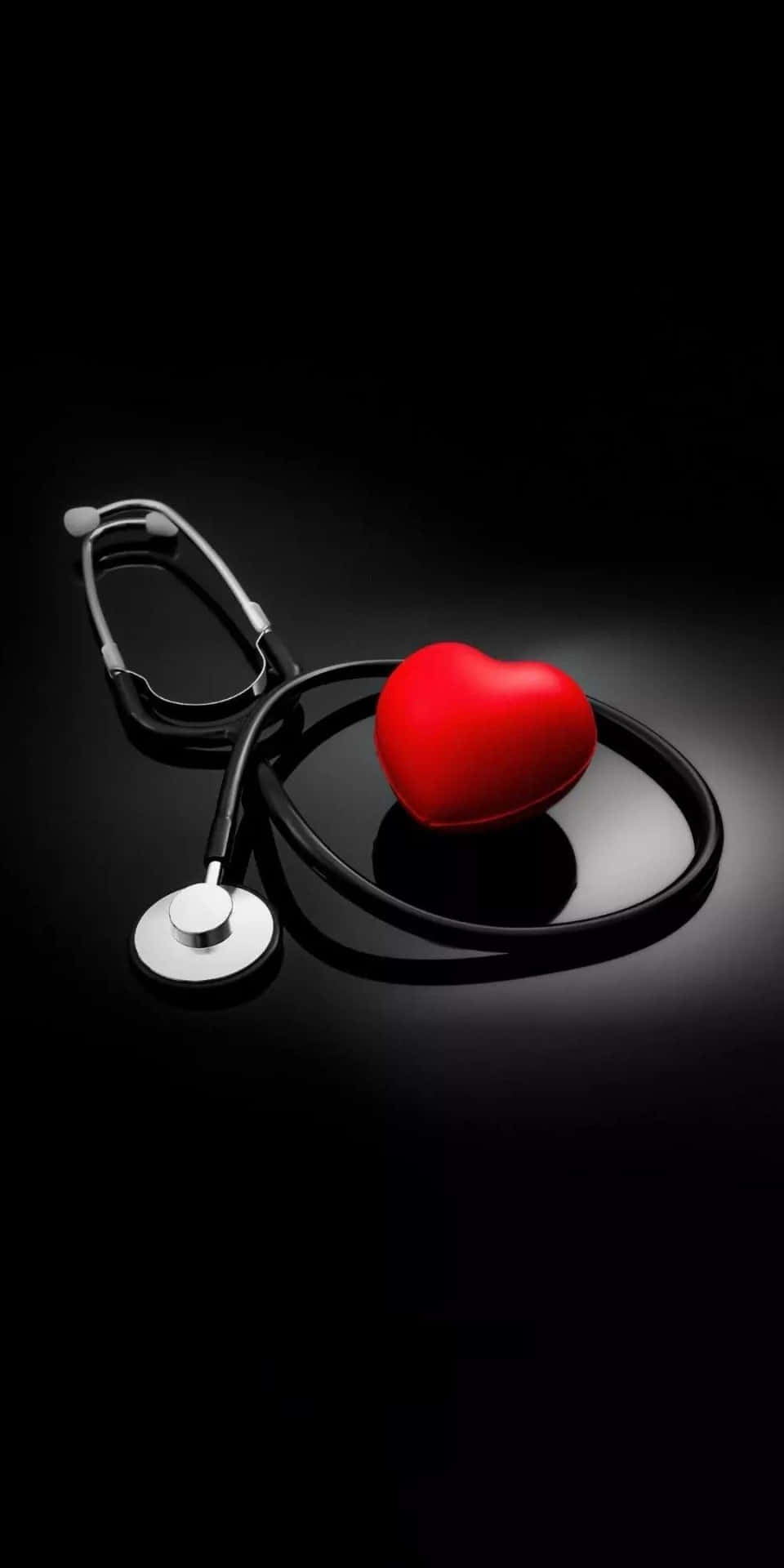 A Stethoscope And A Red Heart On A Black Background