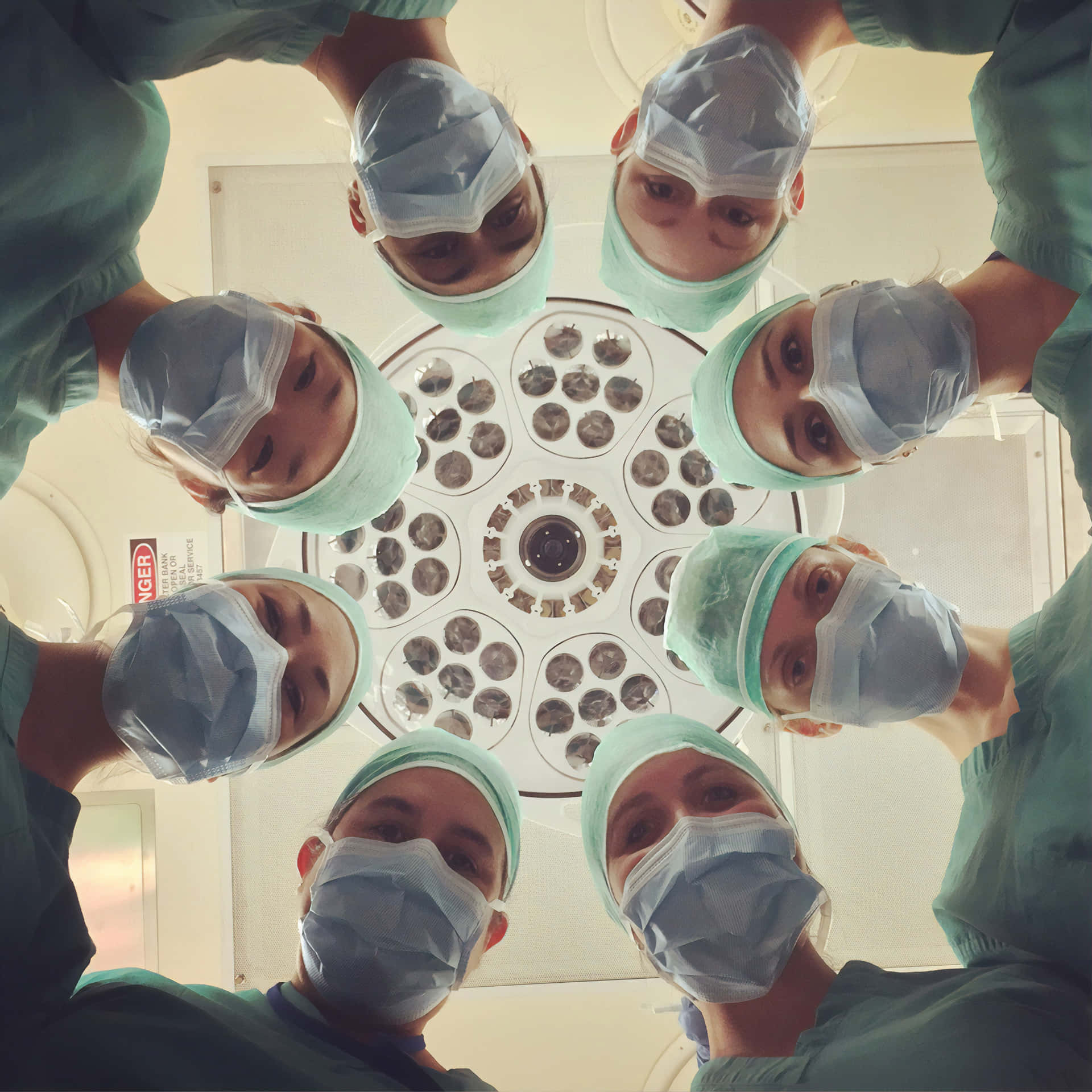 A Group Of Surgeons In A Circle