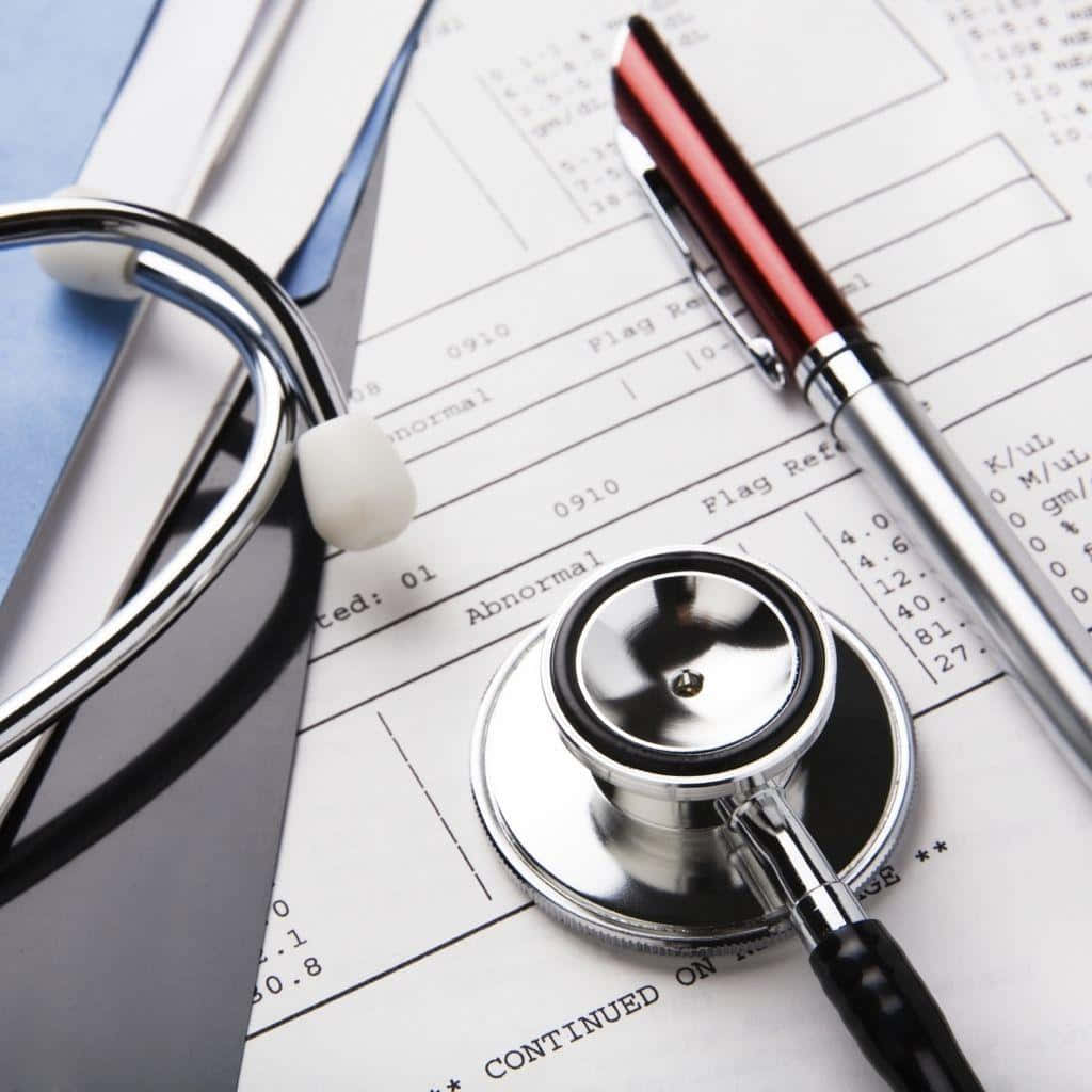 Medical Report Stethoscope Pen Concept Wallpaper