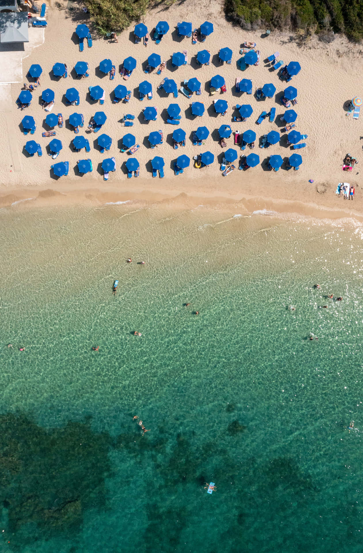 Download Serene Mediterranean Beach at Sunset Wallpaper | Wallpapers.com