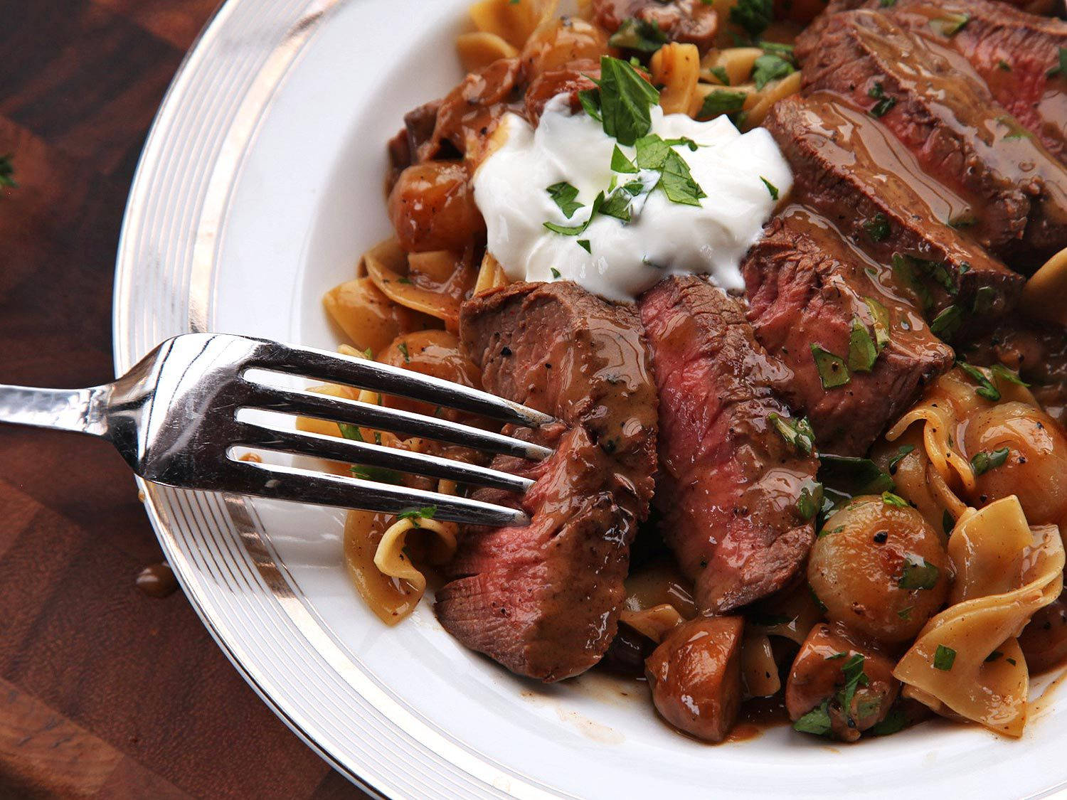 Delectable Medium-Rare Beef Stroganoff Served with Farfalle Pasta Wallpaper