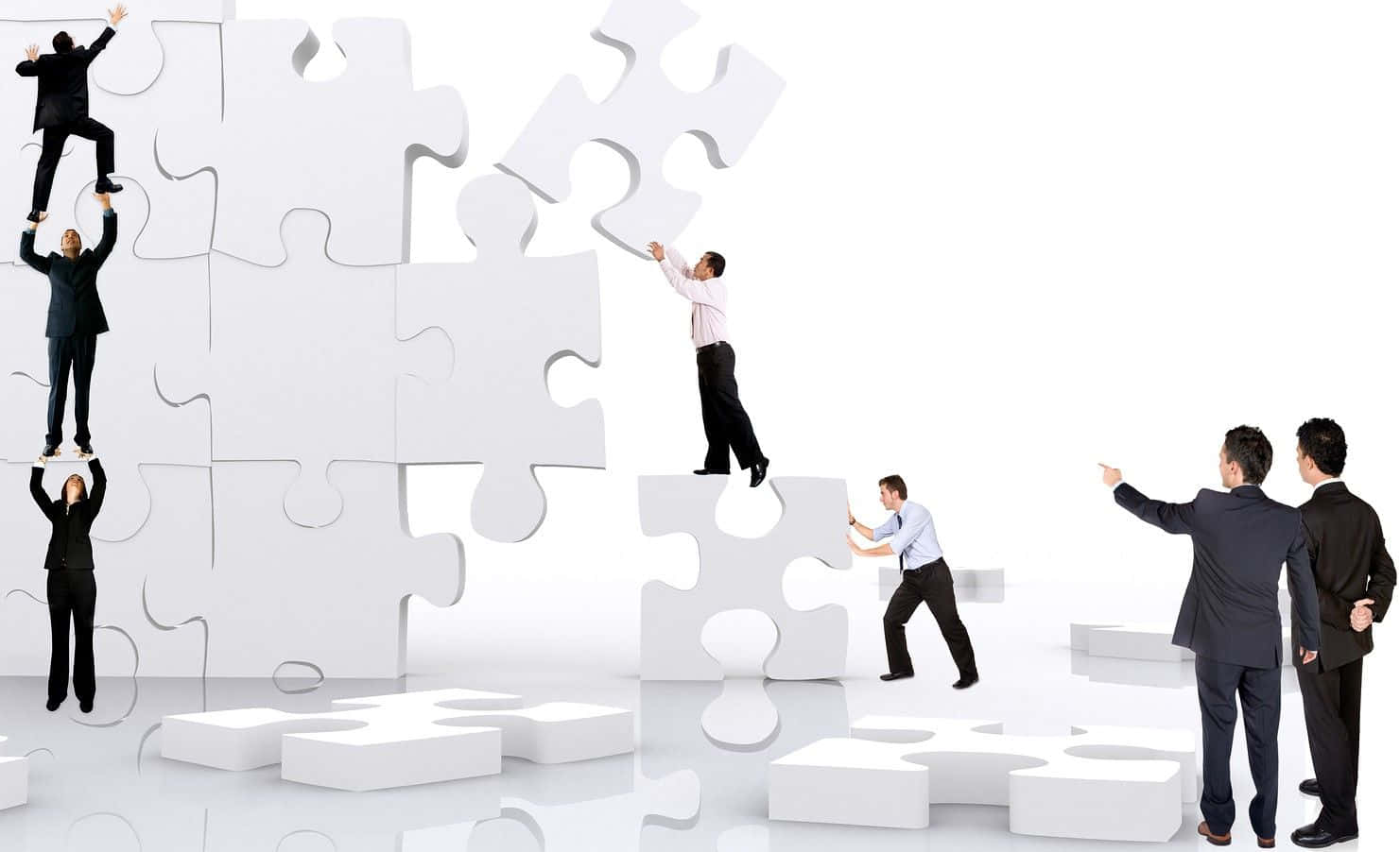 Business People Standing On A Puzzle Piece