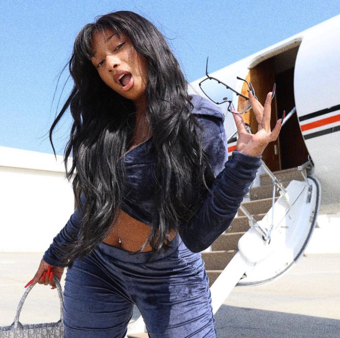 Megan Thee Stallion And Airplane Wallpaper