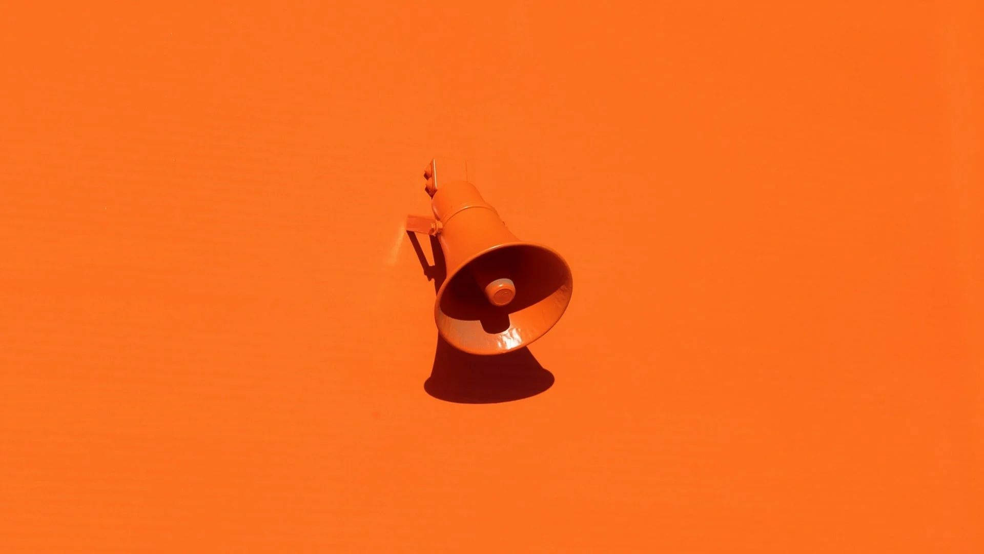 Megaphone On Orange Background Wallpaper