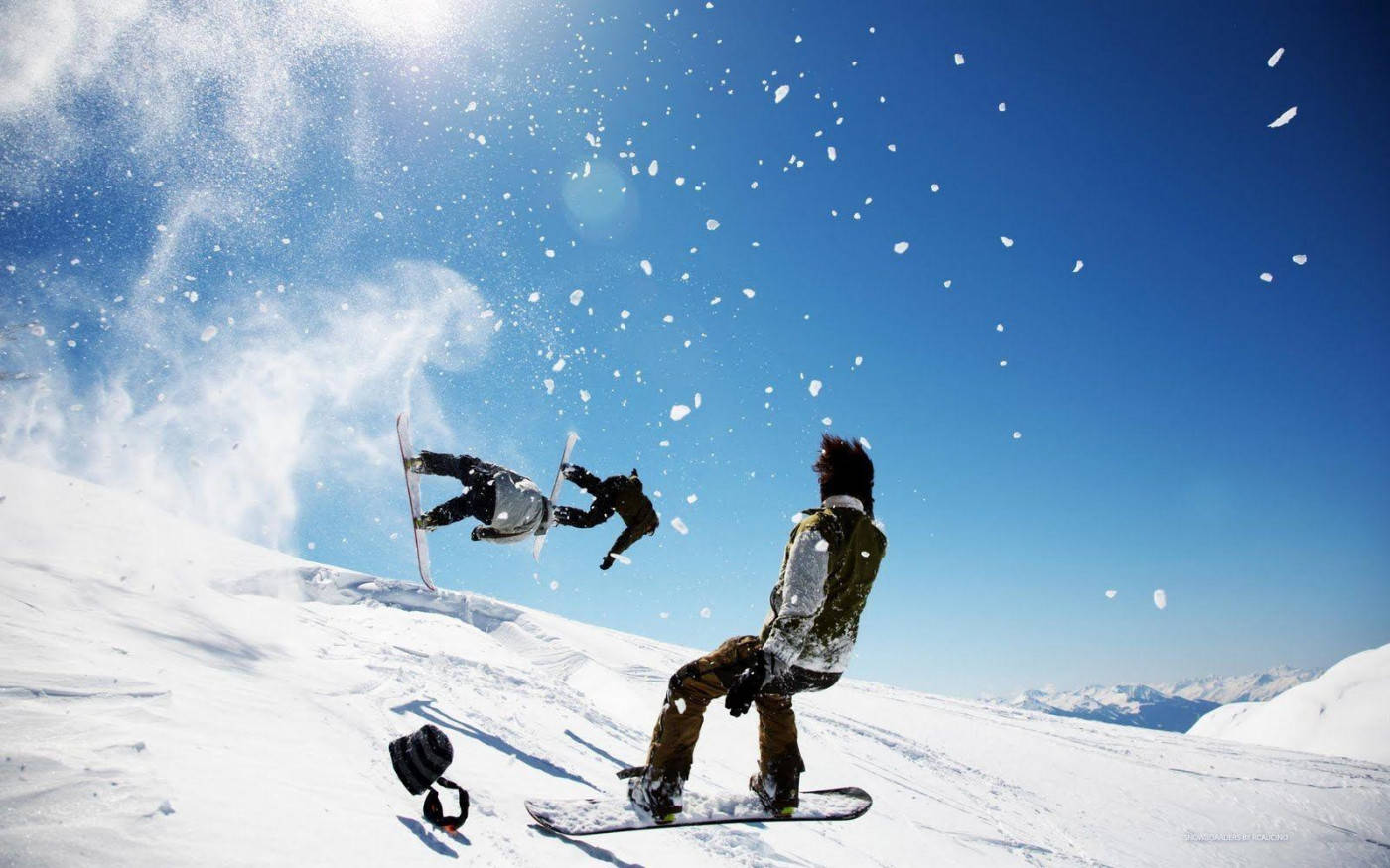 Men Doing Tricks With Snowboard Background