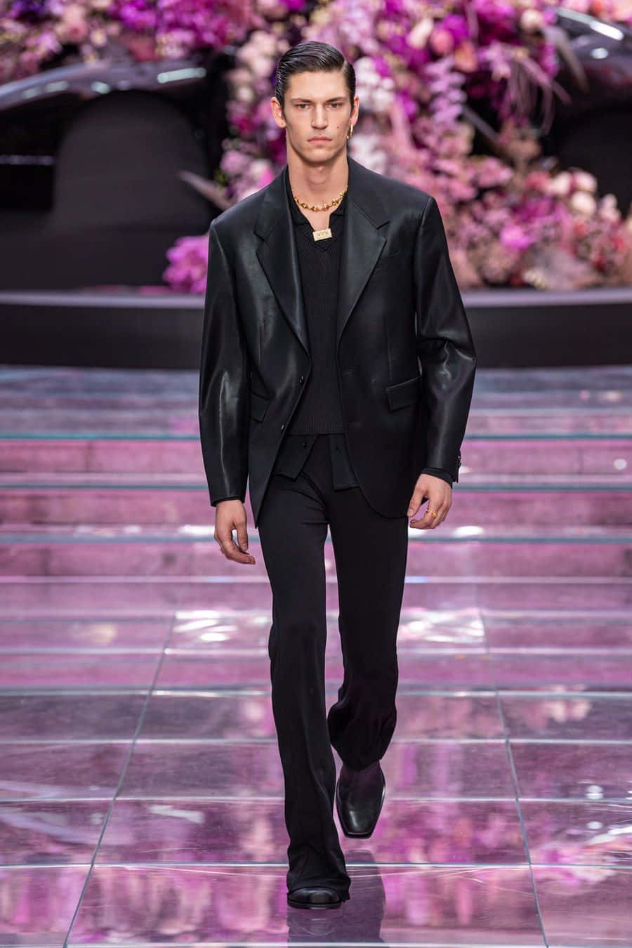 A Man In Black Suits Walks Down The Runway