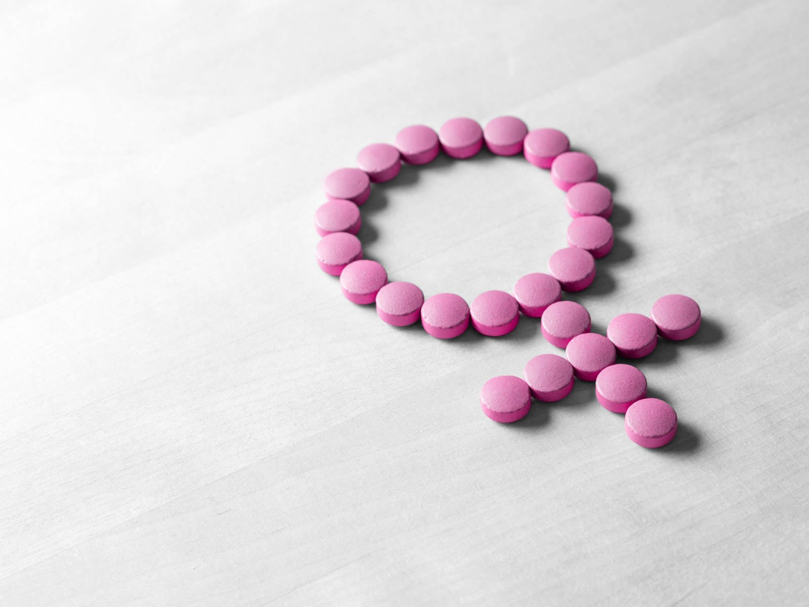 Menopause Hormon Piller Billede Tapet: Et mønster af orange og grønne hormonpiller. Wallpaper