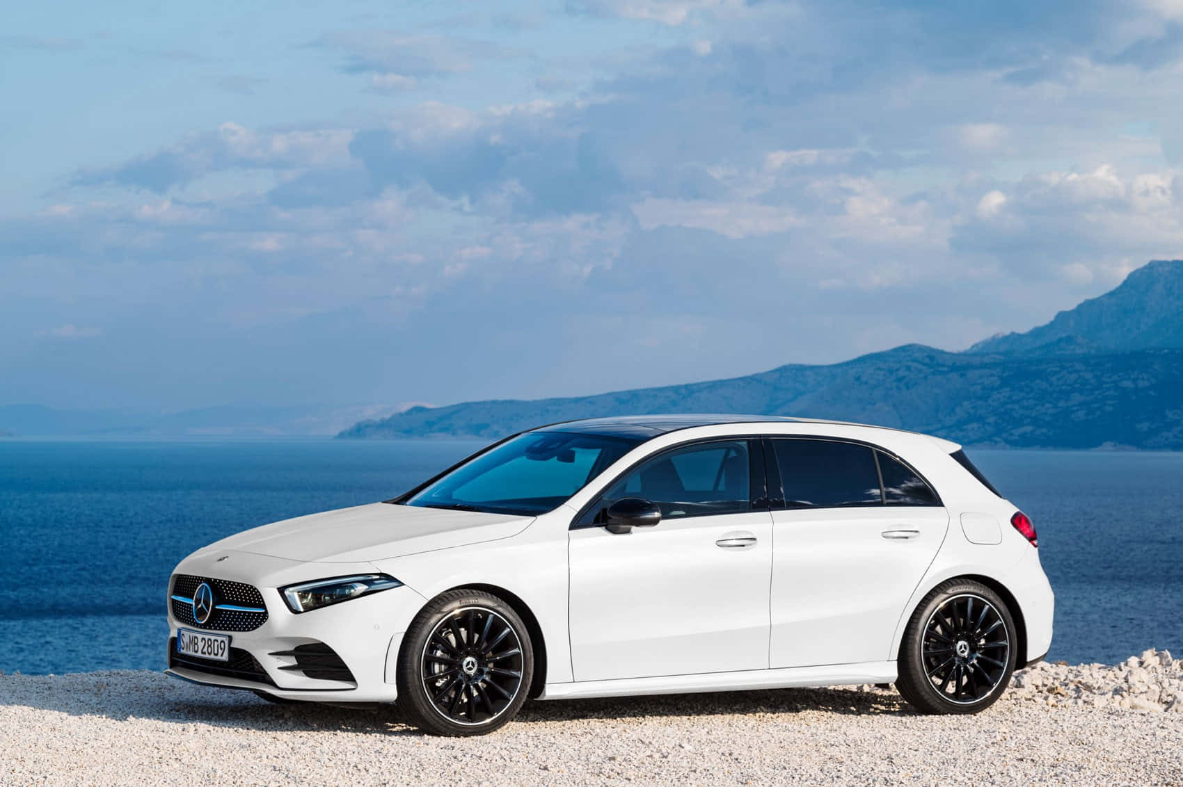 Sleek Mercedes Benz A-Class in a Modern City Setting Wallpaper