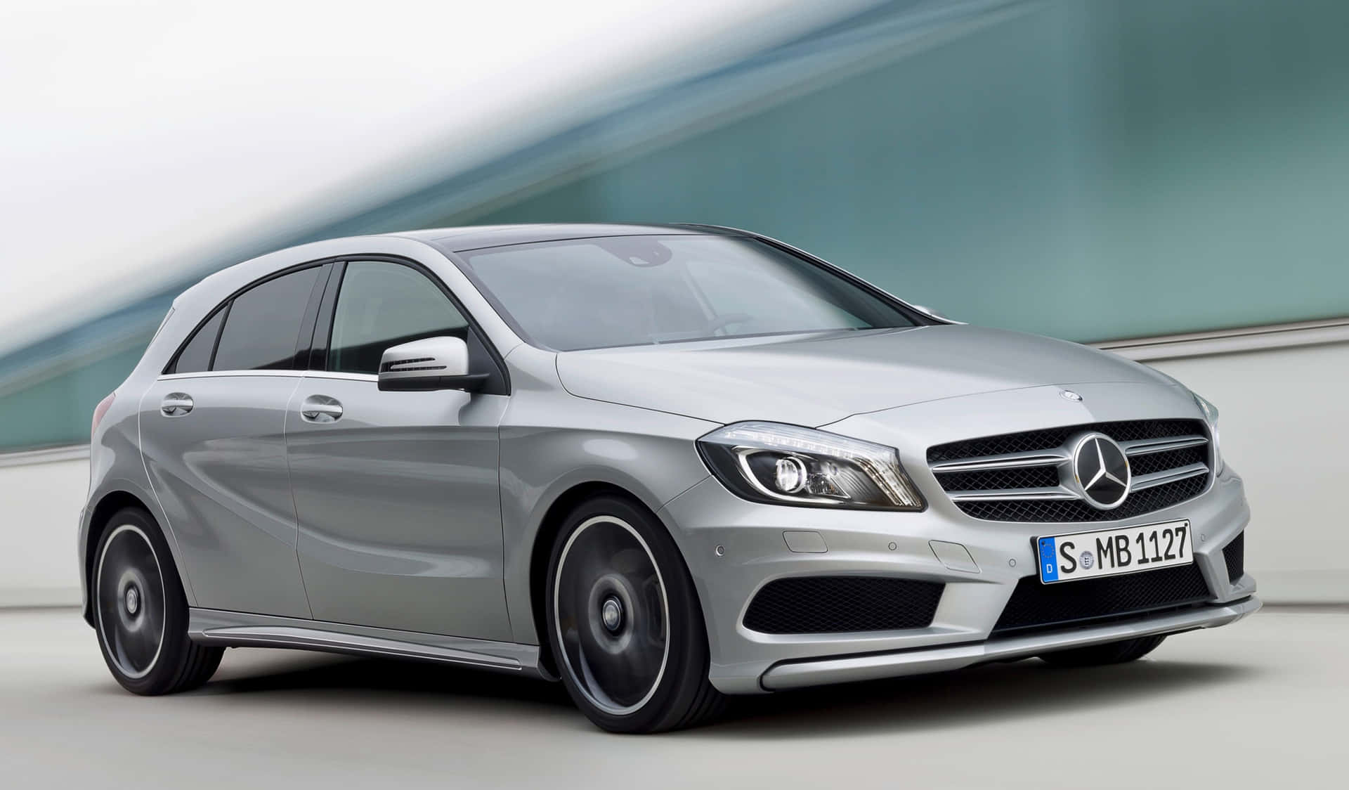 Sleek and Stylish Mercedes Benz A-Class on the Road Wallpaper