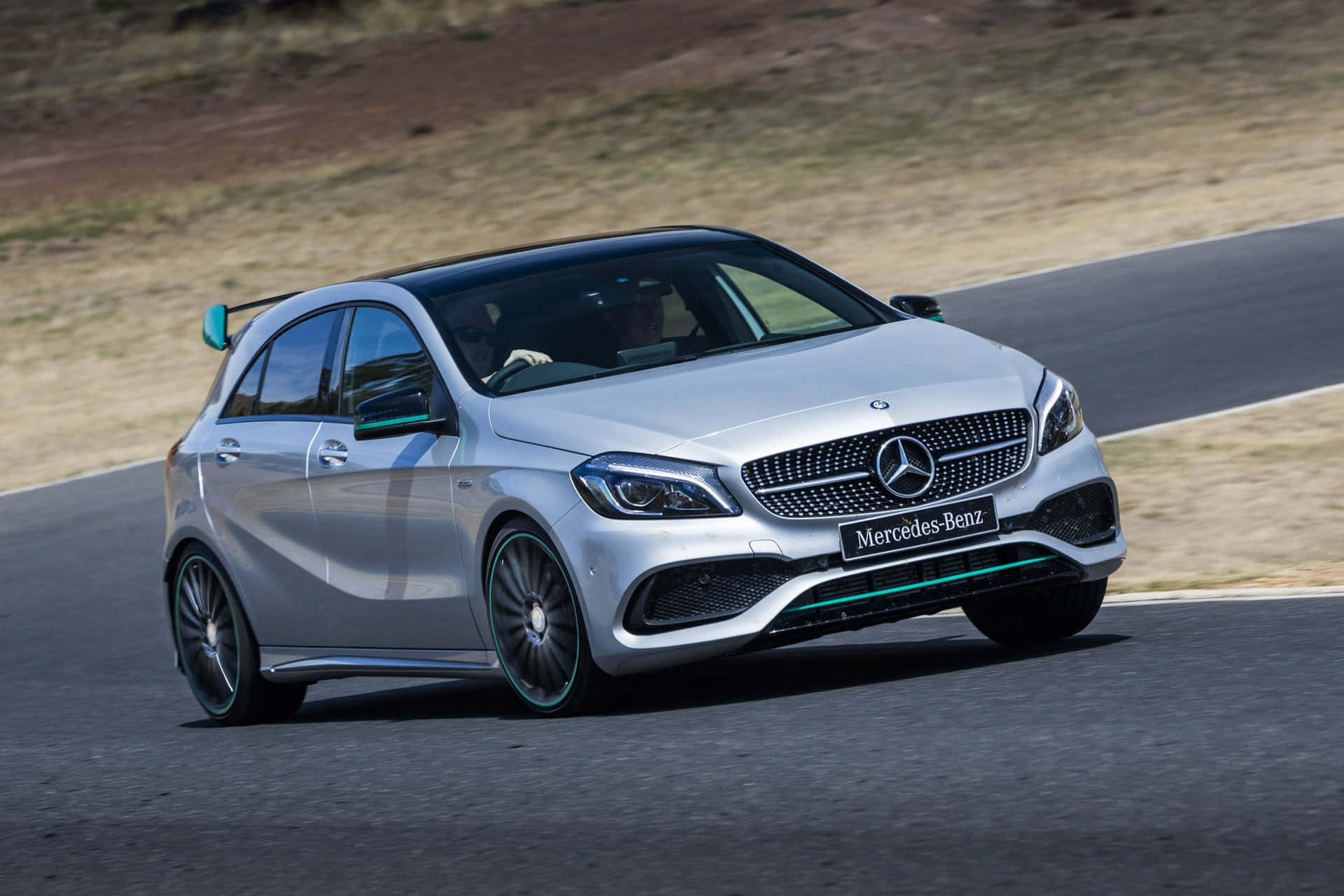 Sleek and Stylish Mercedes Benz A-Class in Action Wallpaper