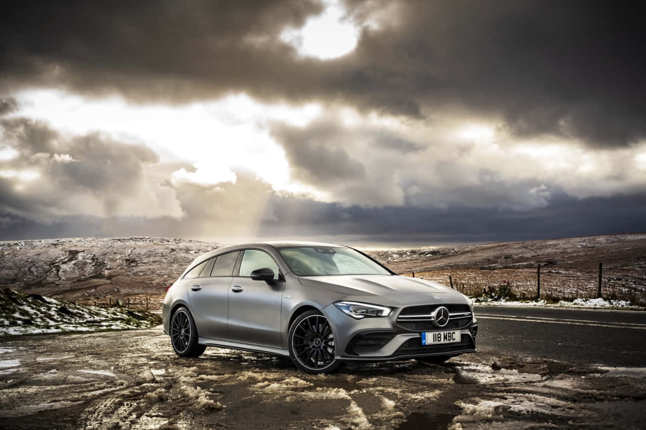 Sleek and Stylish Mercedes Benz CLA-Class in Motion Wallpaper