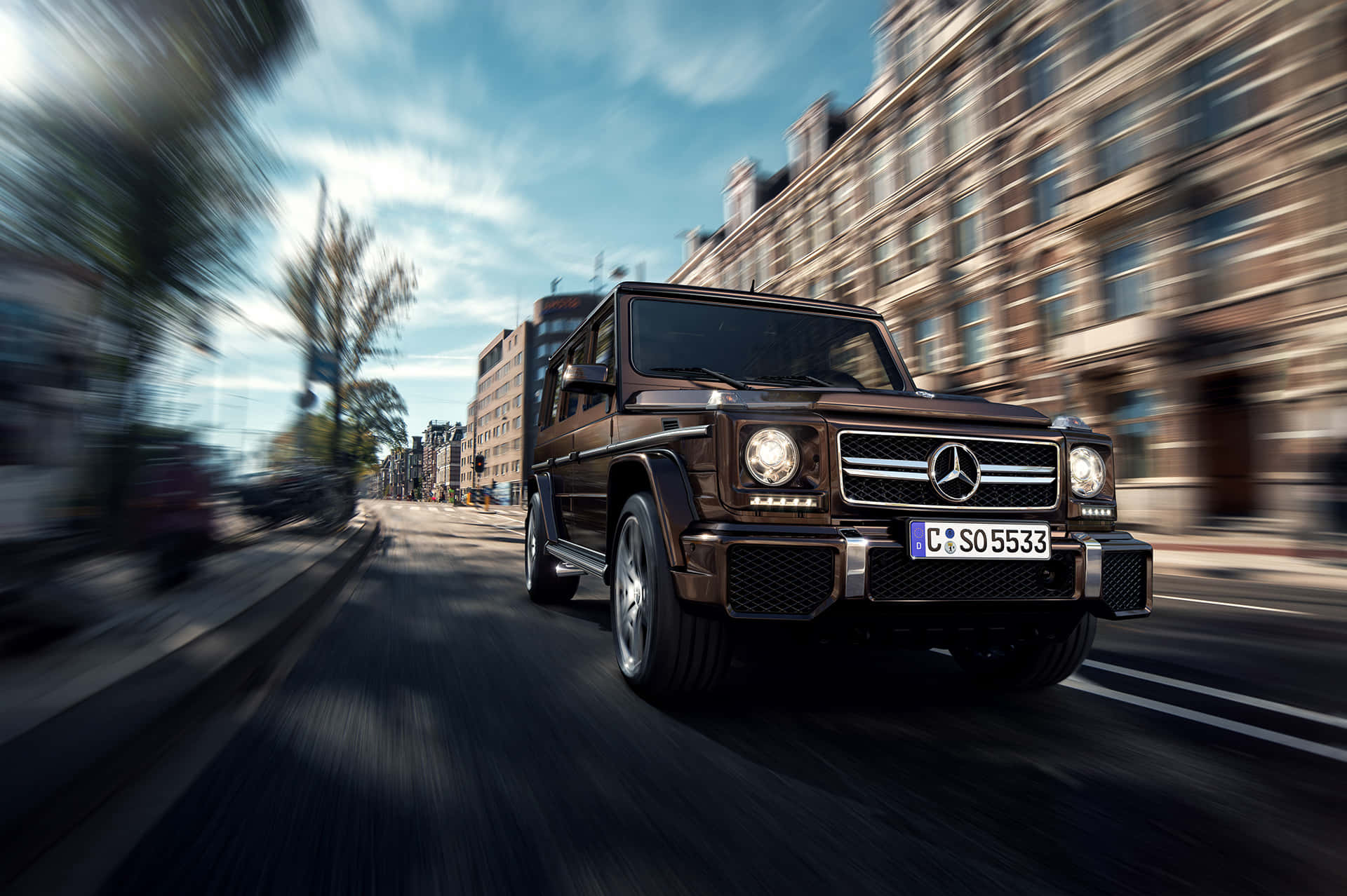 Mercedes Benz G Wagon Speeding Through City.jpg Wallpaper