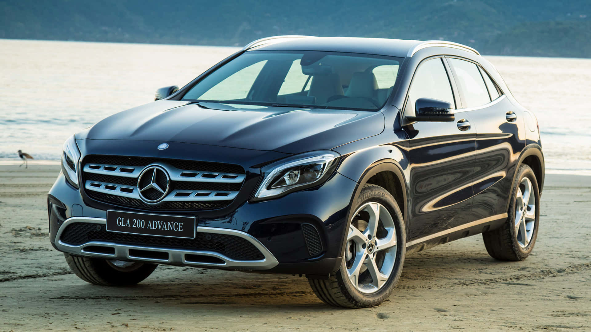 Sleek and Stylish Mercedes-Benz GLA-Class on a Scenic Drive Wallpaper