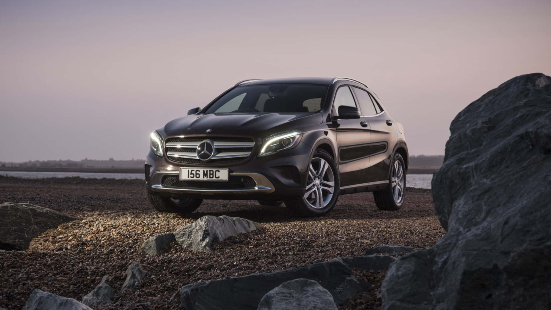 Luxurious White Mercedes-Benz GLA-Class on a Scenic Road Wallpaper