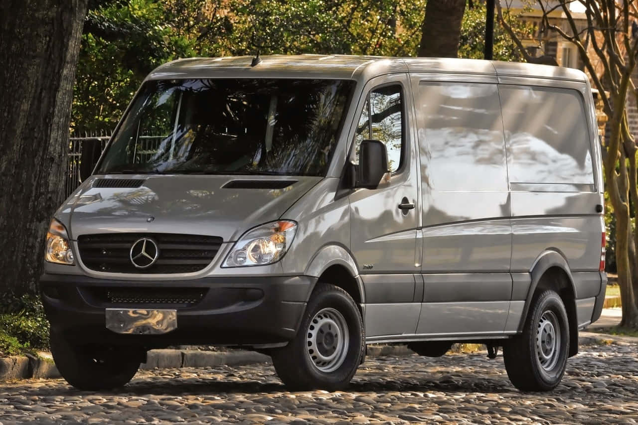 A sleek and stylish Mercedes Benz Sprinter on the road Wallpaper
