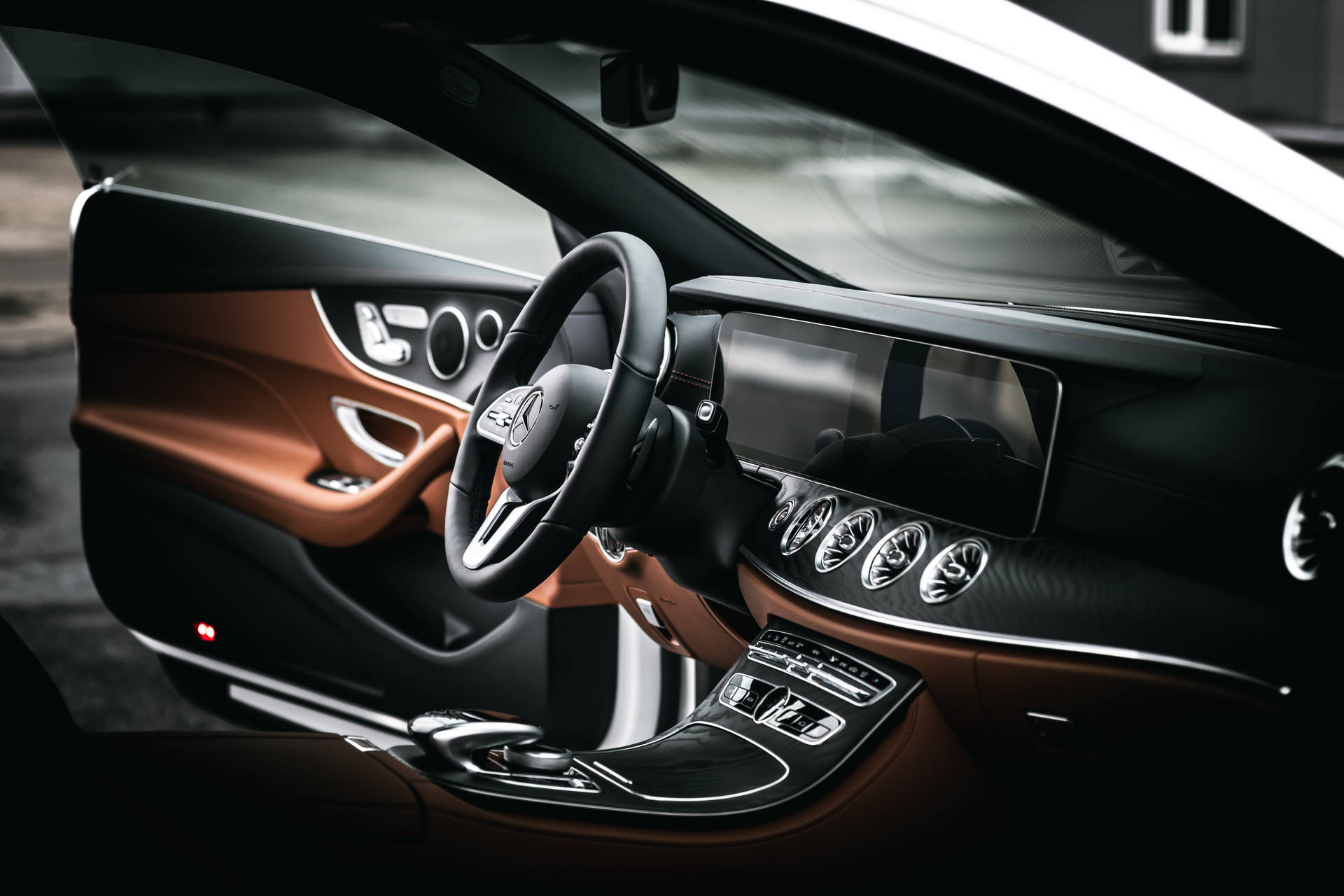 Caption: Majestic Interior of Mercedes E200 Steering Wheel Wallpaper