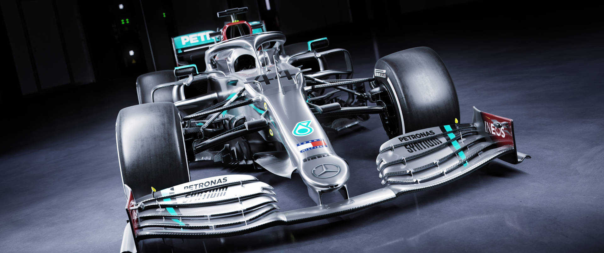 The Mercedes F1 Racing Team, Ready to Take the Track Wallpaper