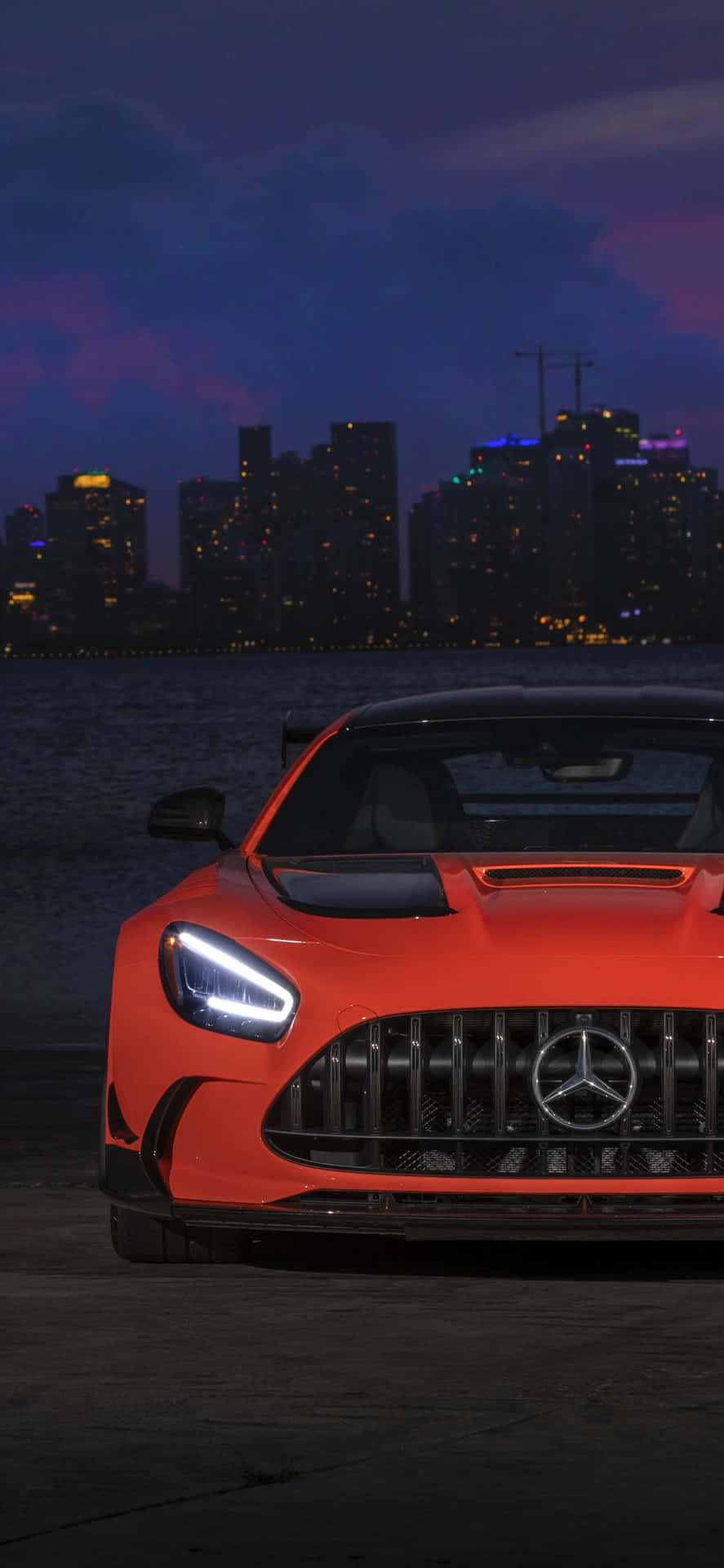 An iconic Mercedes GTS stands out with a sleek black exterior Wallpaper