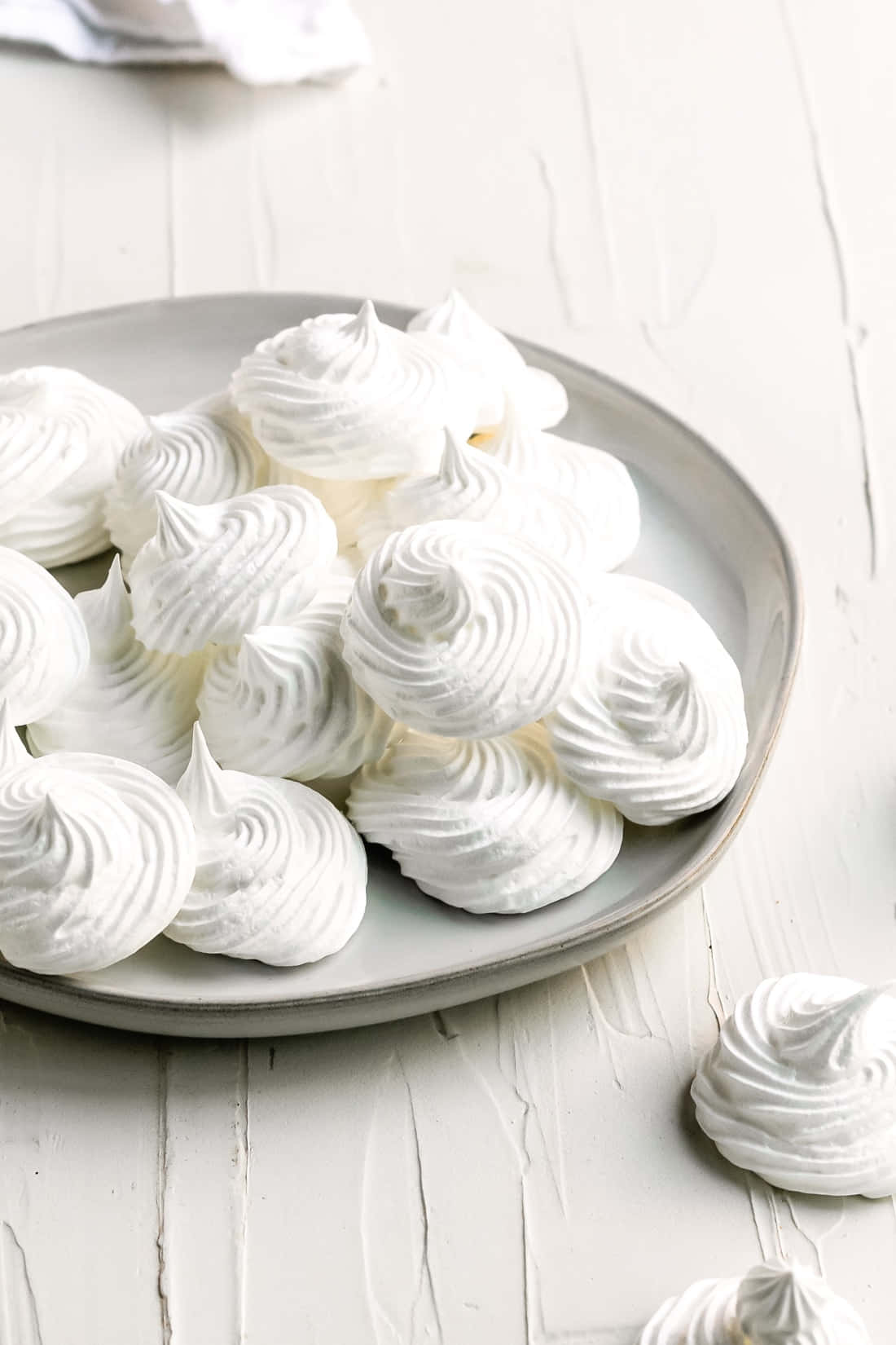 Sweet and tart meringue desserts deliciously arranged in a row. Wallpaper