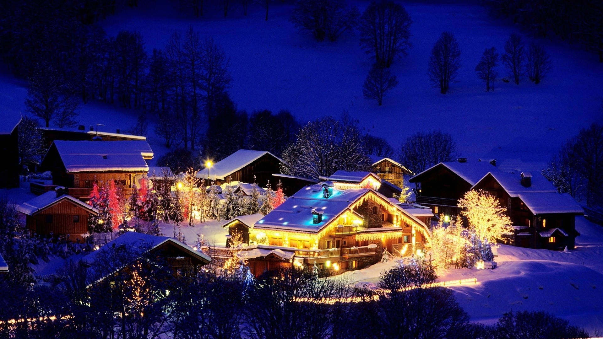 Stunning Christmas Village Illuminated by Glowing Lights Wallpaper