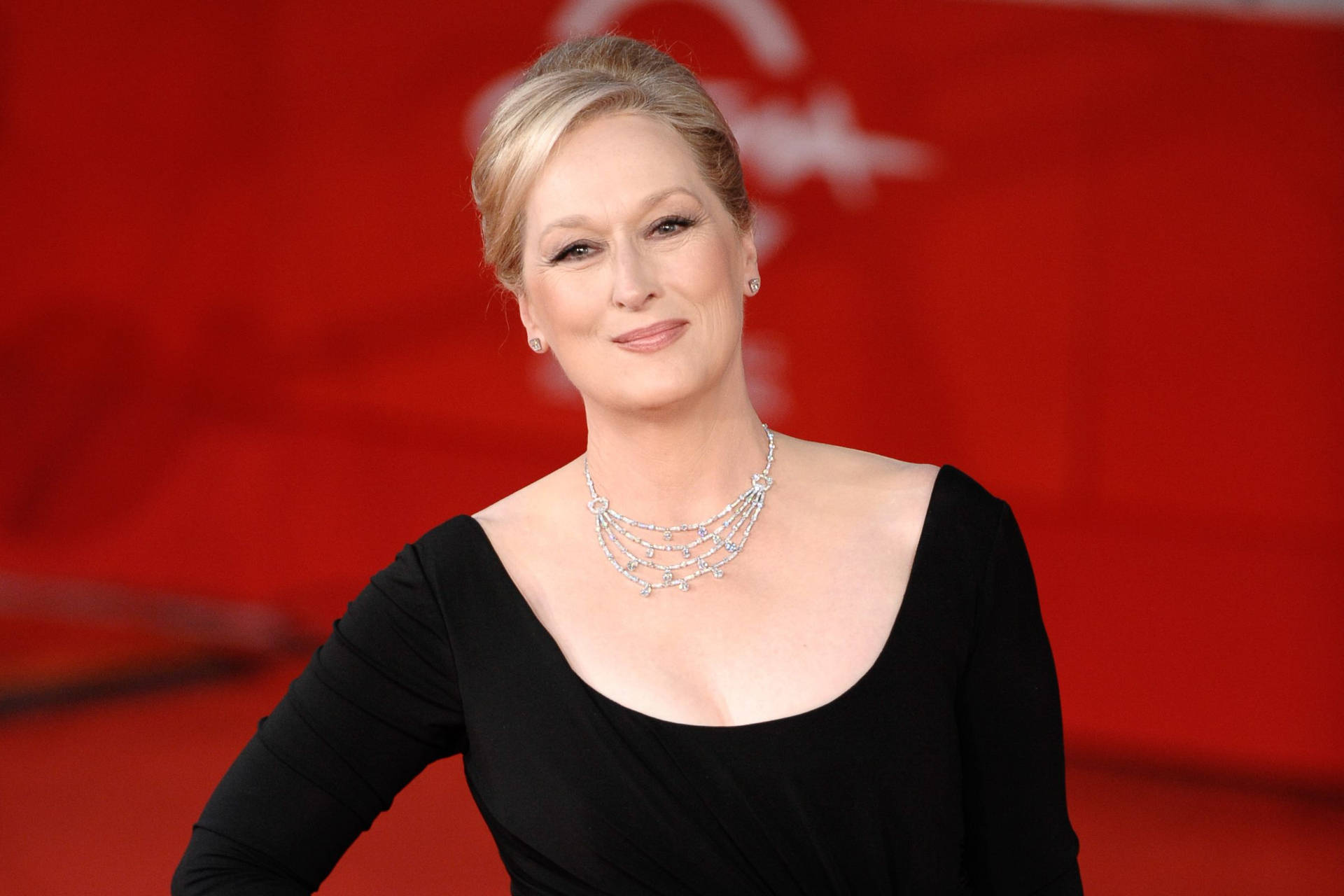Meryl Streep On A Red Backdrop Wallpaper