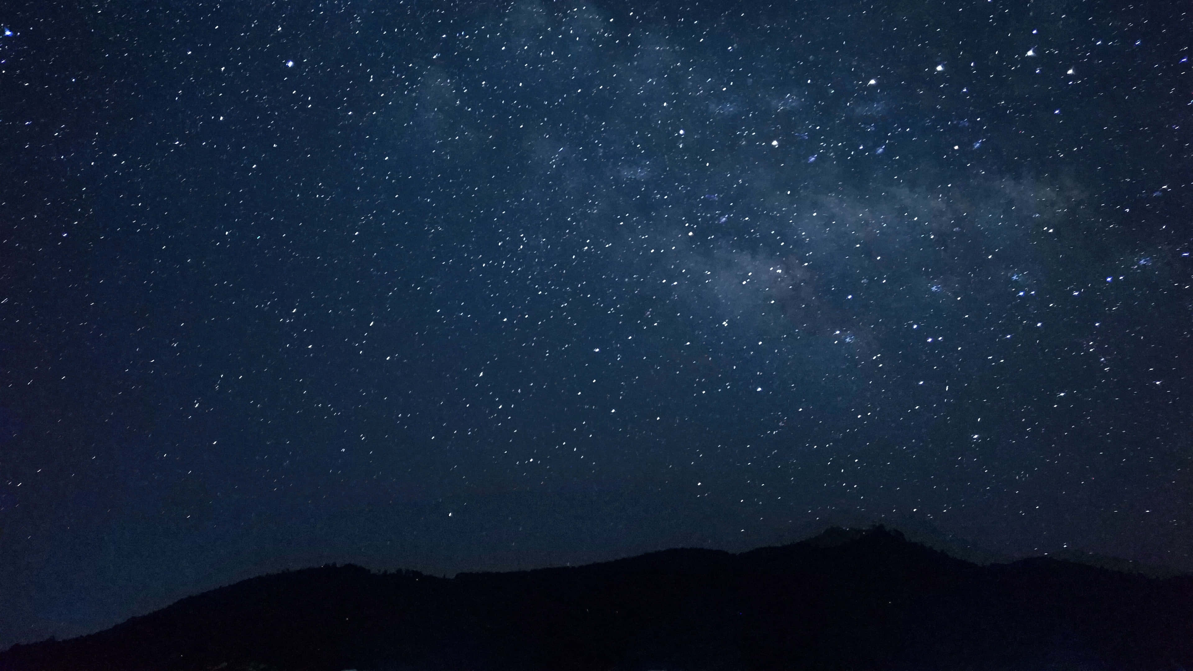 "mesmerizing 4k View Of A Starlit Sky" Wallpaper