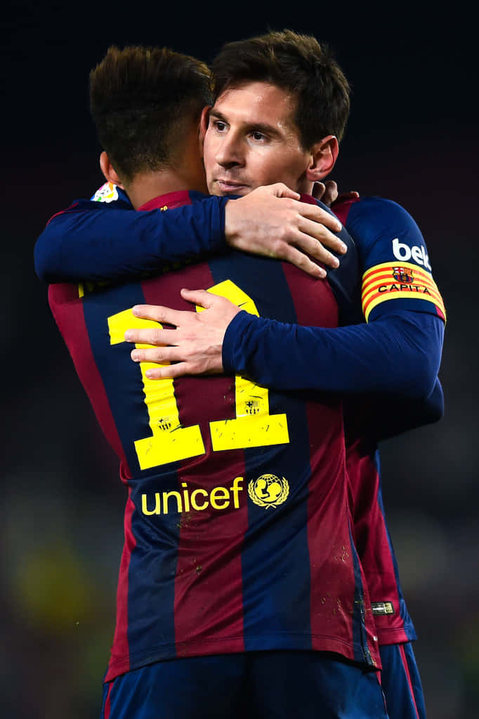 Image  Lionel Messi and Neymar embracing on the soccer field. Wallpaper