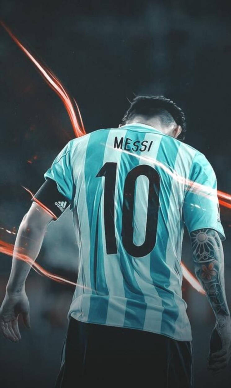 Messiargentina Orange Light - Messi Med Argentina-tröjan I En Ljus Orangeskimrande Bakgrund. Wallpaper