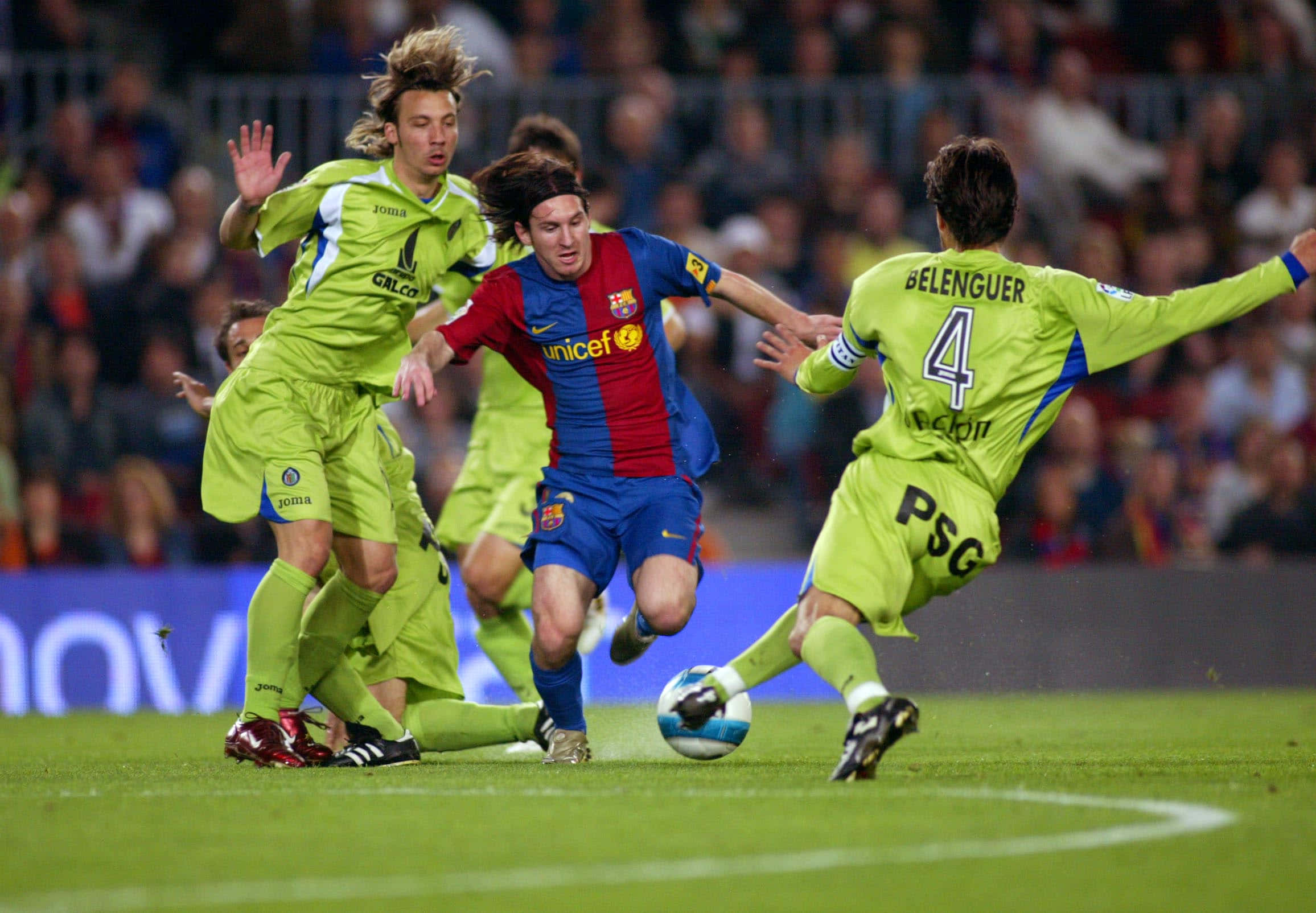Messi Exhibiting Exceptional Dribbling Skills On The Field Wallpaper