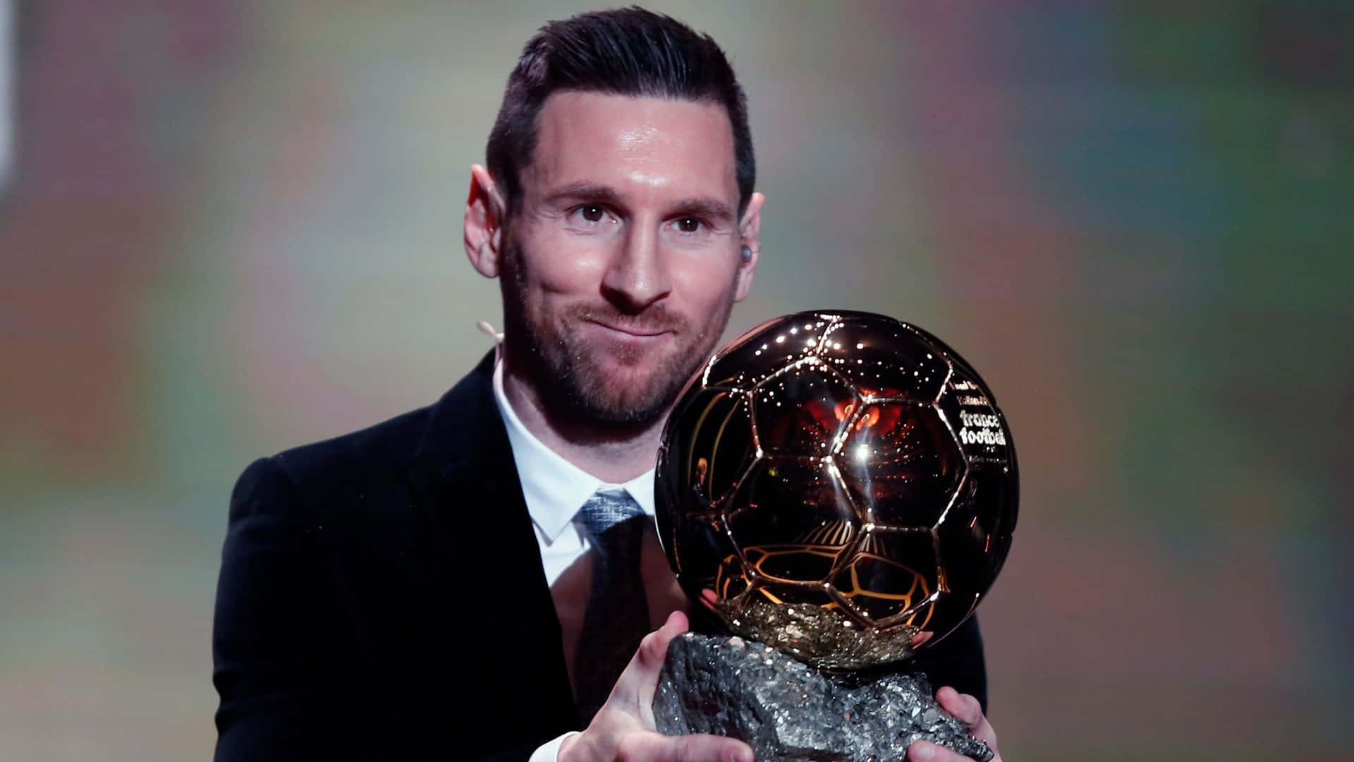 Messi Holding Ballon Dor Award Wallpaper
