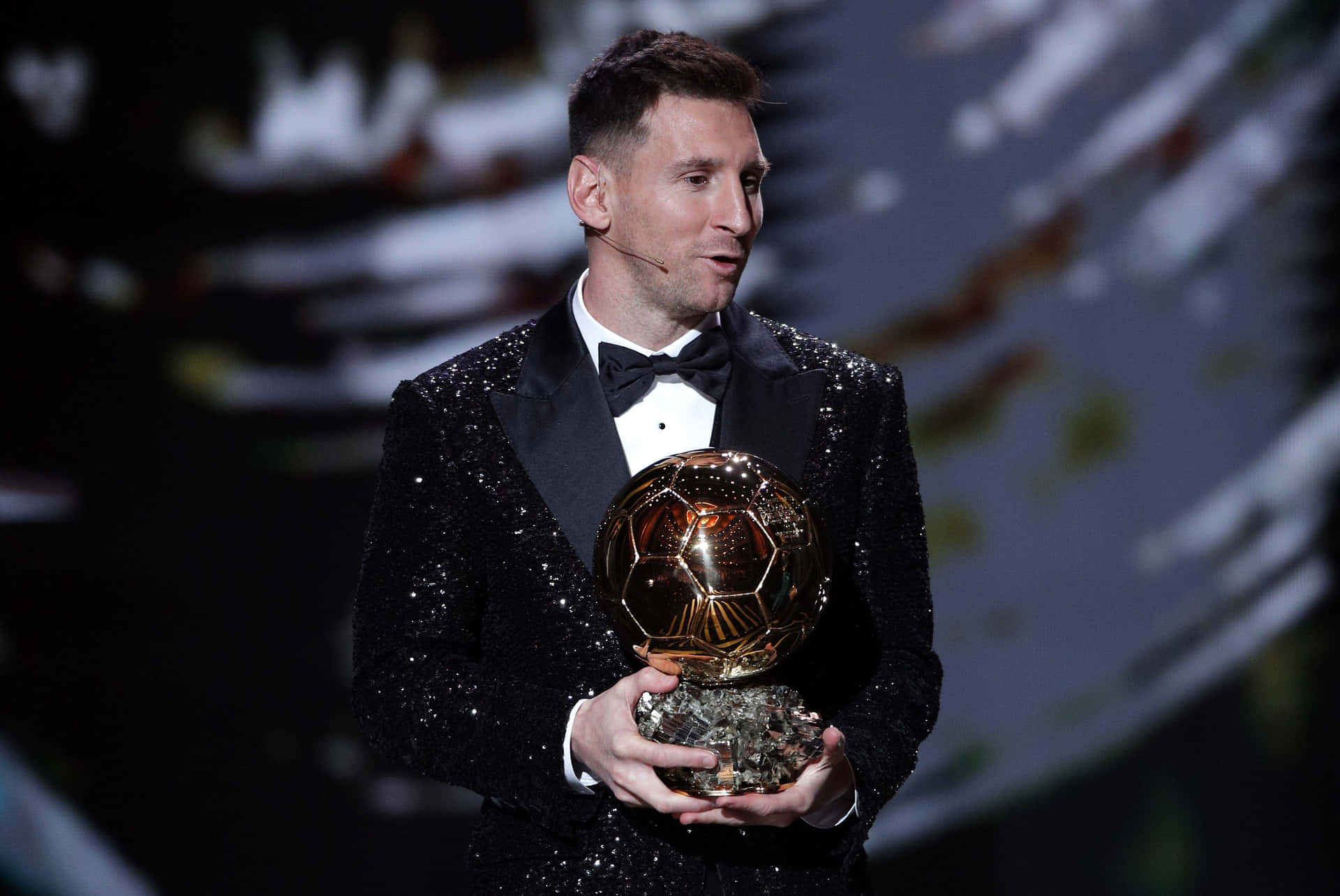 Messi Holding Ballond Or Award Wallpaper