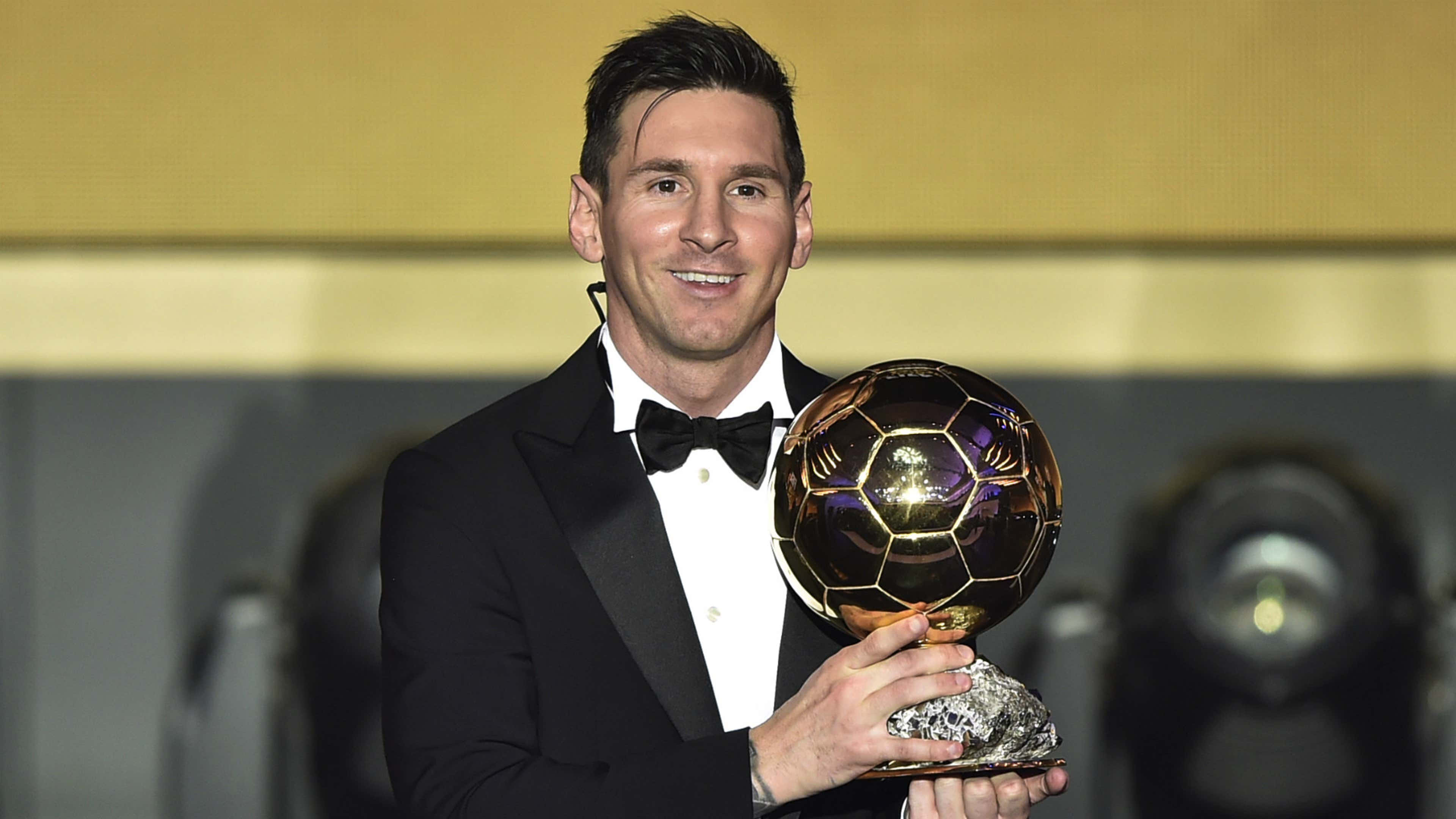 Messi Holding His Seventh Ballon D'or Trophy Wallpaper
