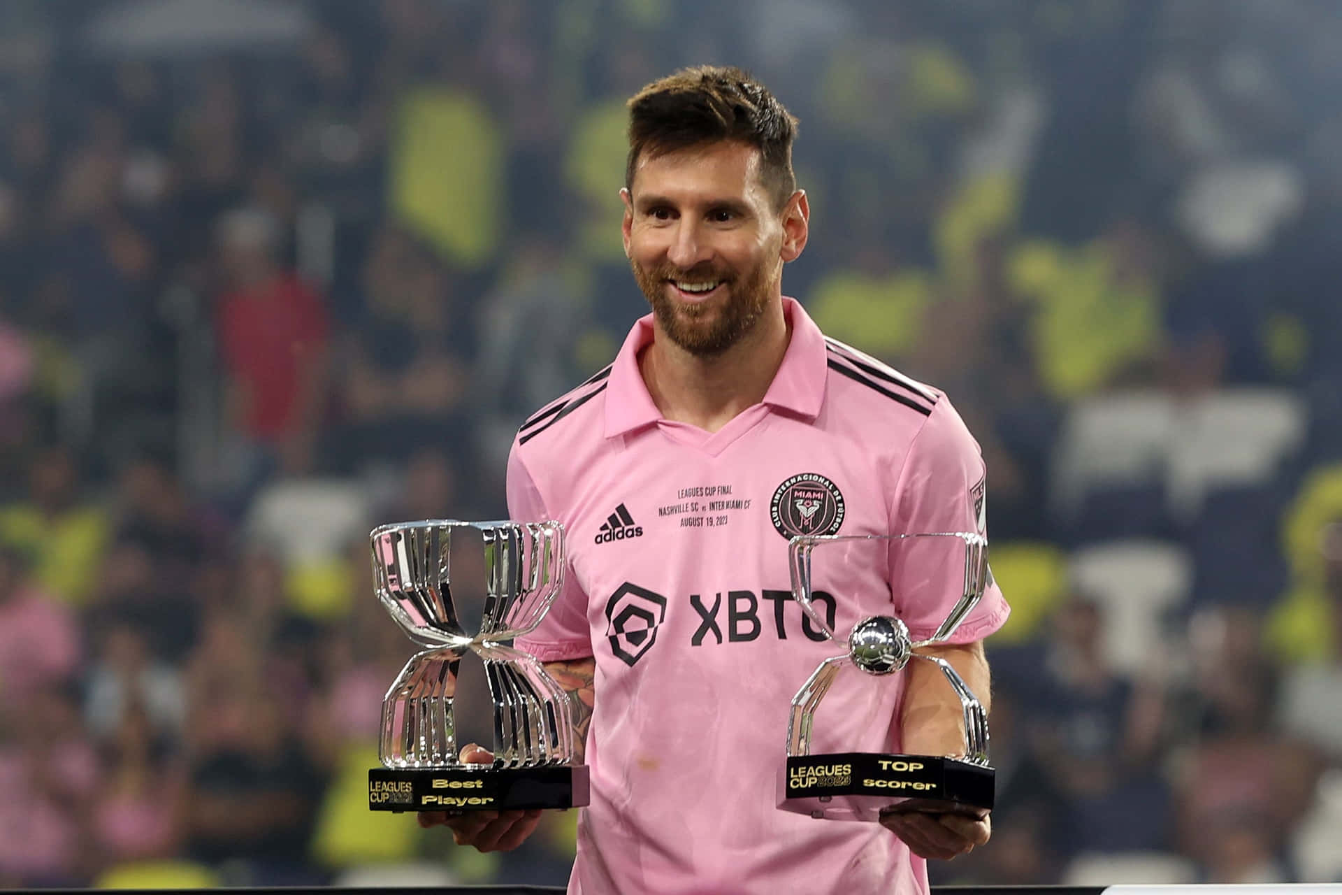 Messi Holding Trophies Inter Miami Wallpaper