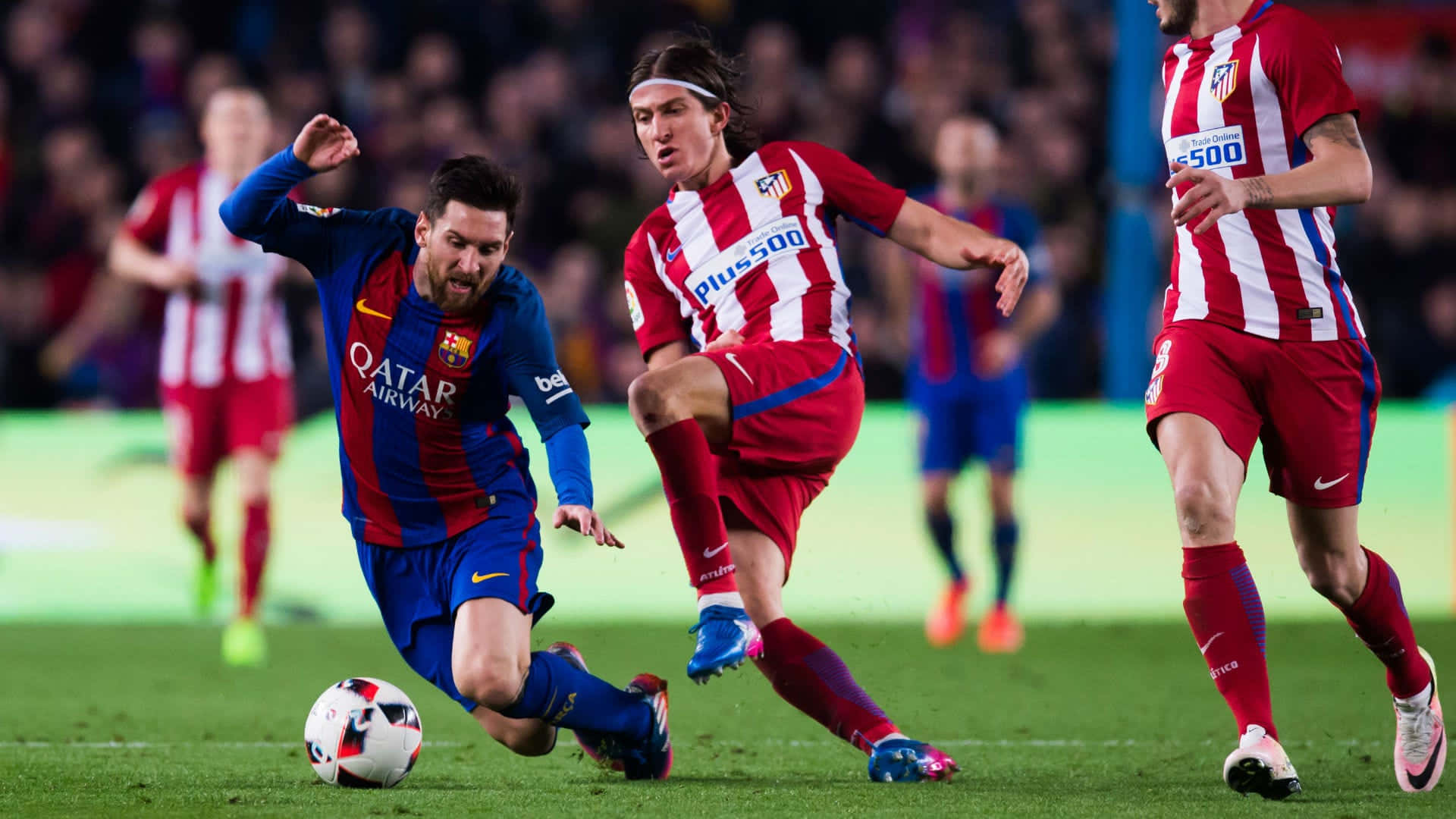 Messi_ In_ Action_ Dribbling_ Past_ Defenders Wallpaper