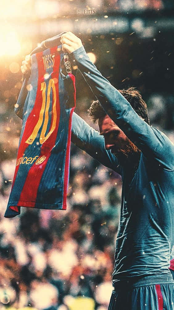 Messisosteniendo La Camiseta Del Barcelona En Un Iphone. Fondo de pantalla