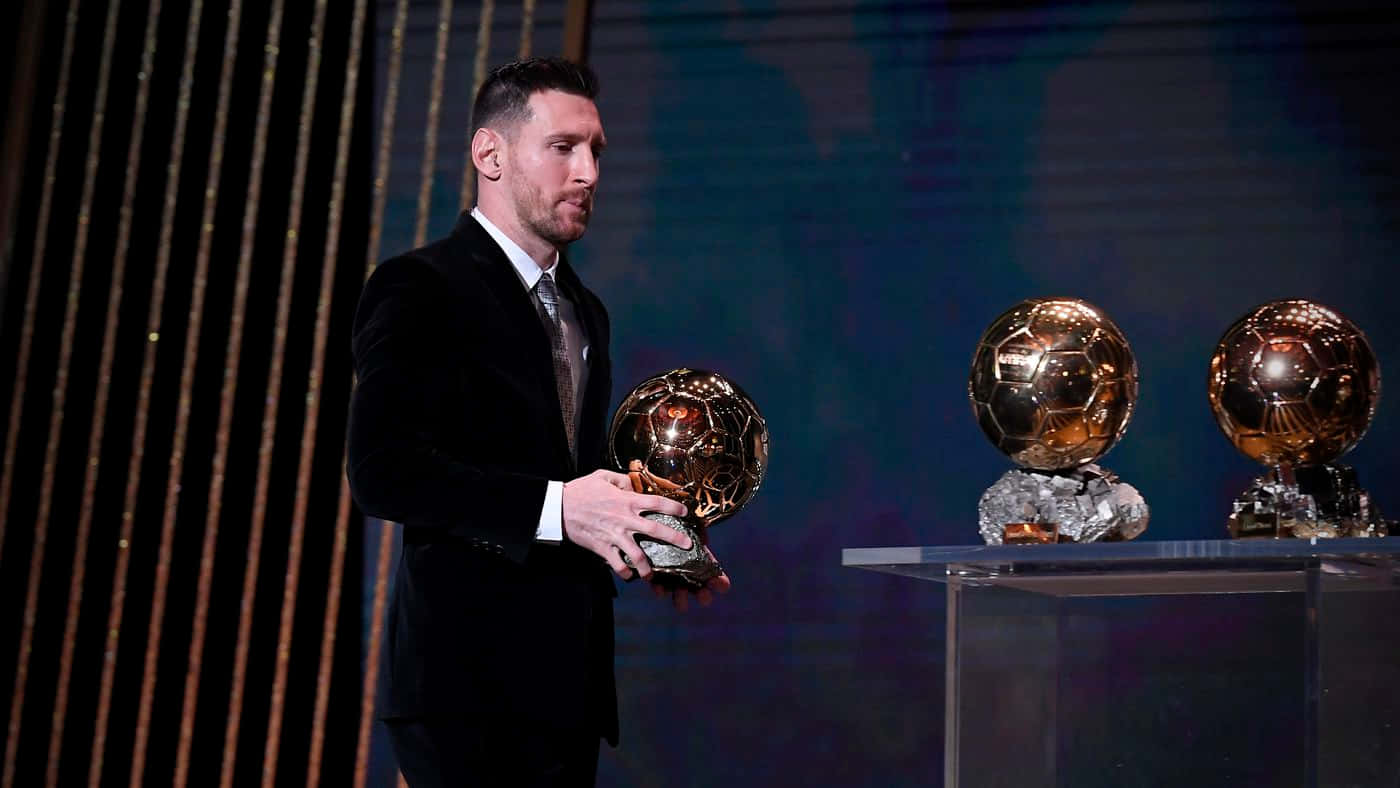 Messi With Golden Balls Wallpaper
