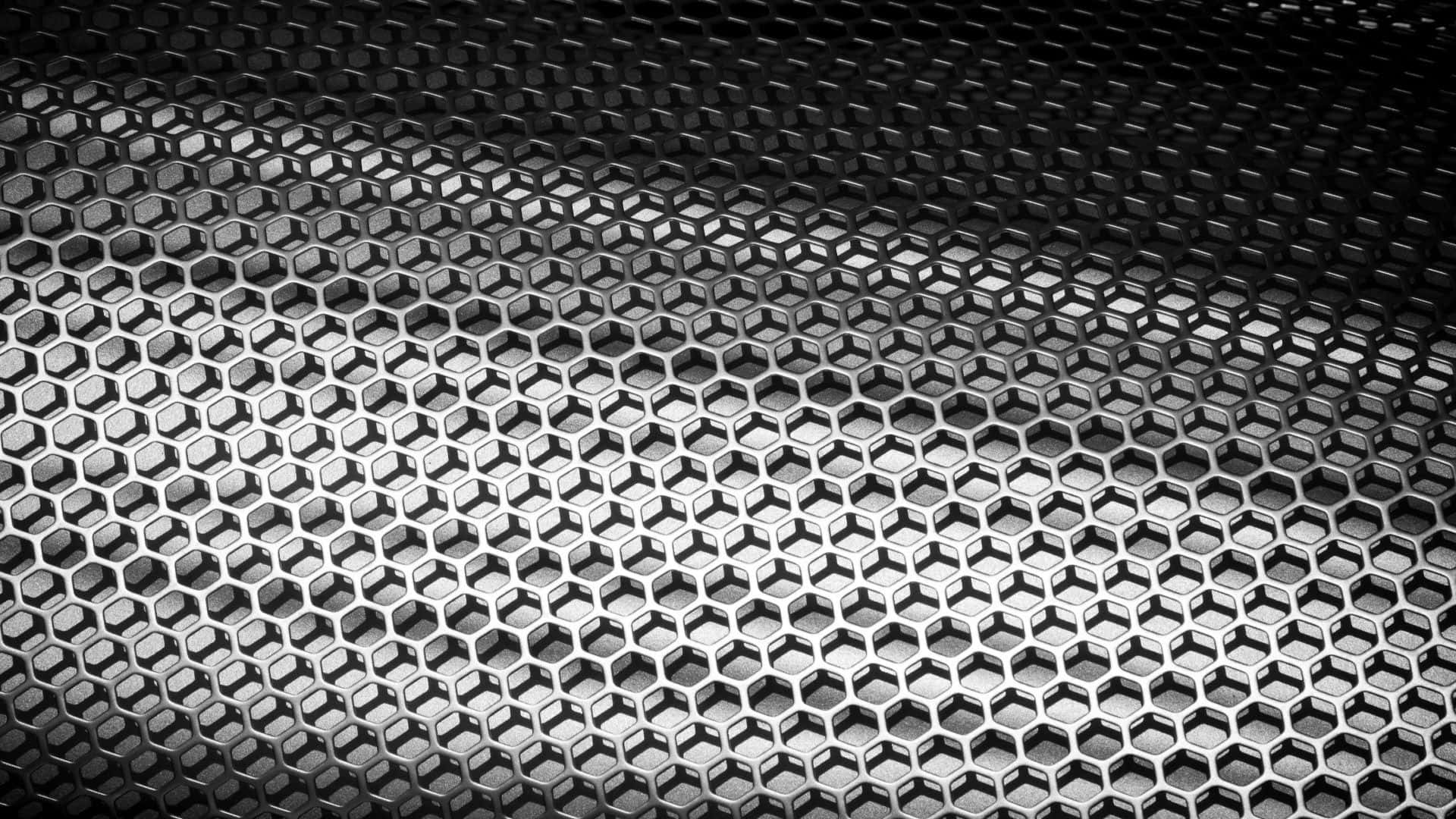 A Black And White Photo Of A Metal Mesh
