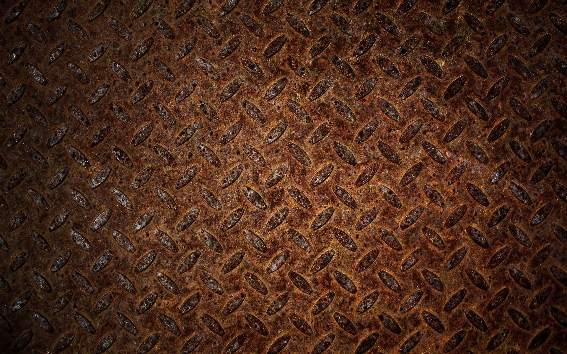 A Close Up Of A Rusty Metal Plate